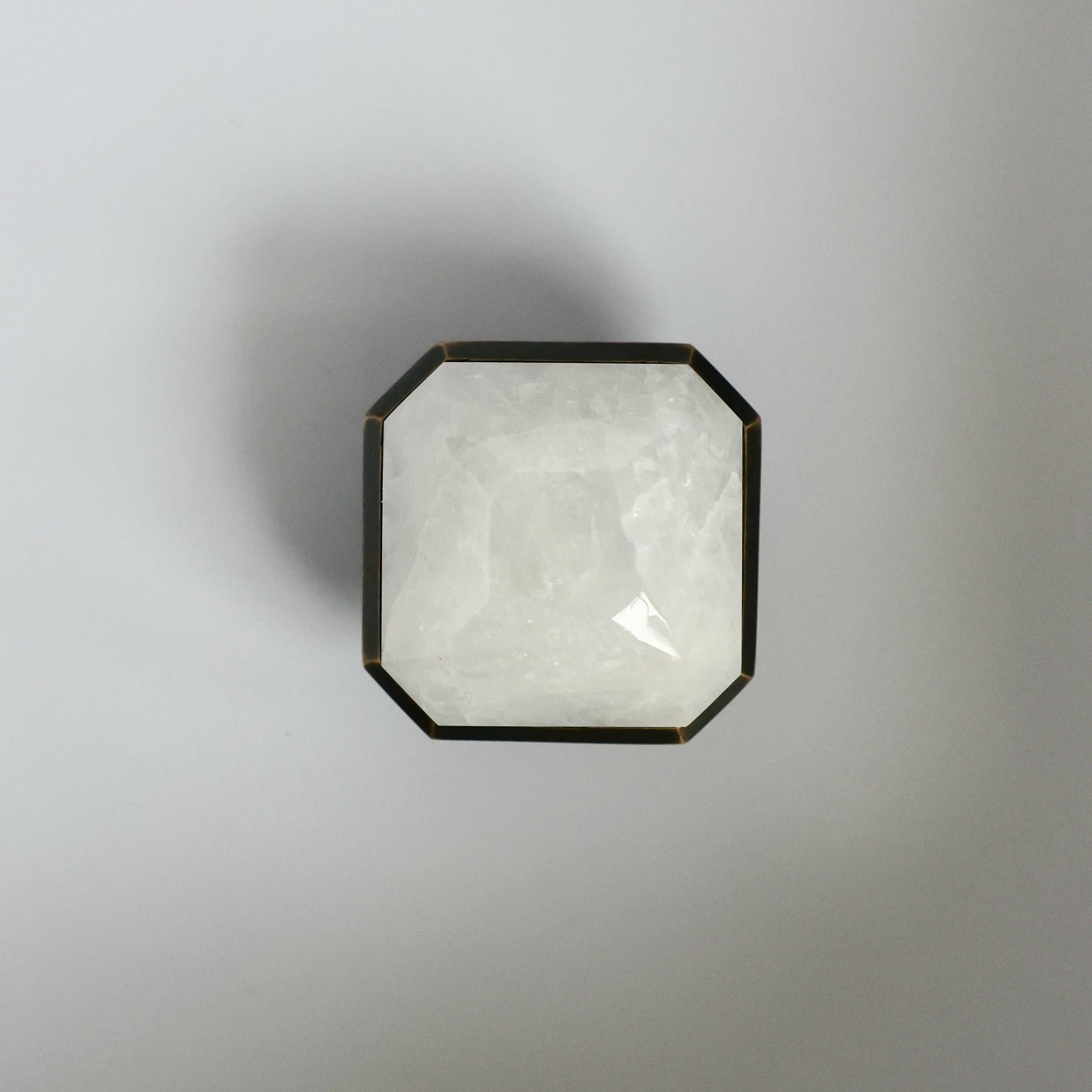 Diamond cut rock crystal knobs with polished brass decoration, created by Phoenix 

Metal finish and custom size upon request.
