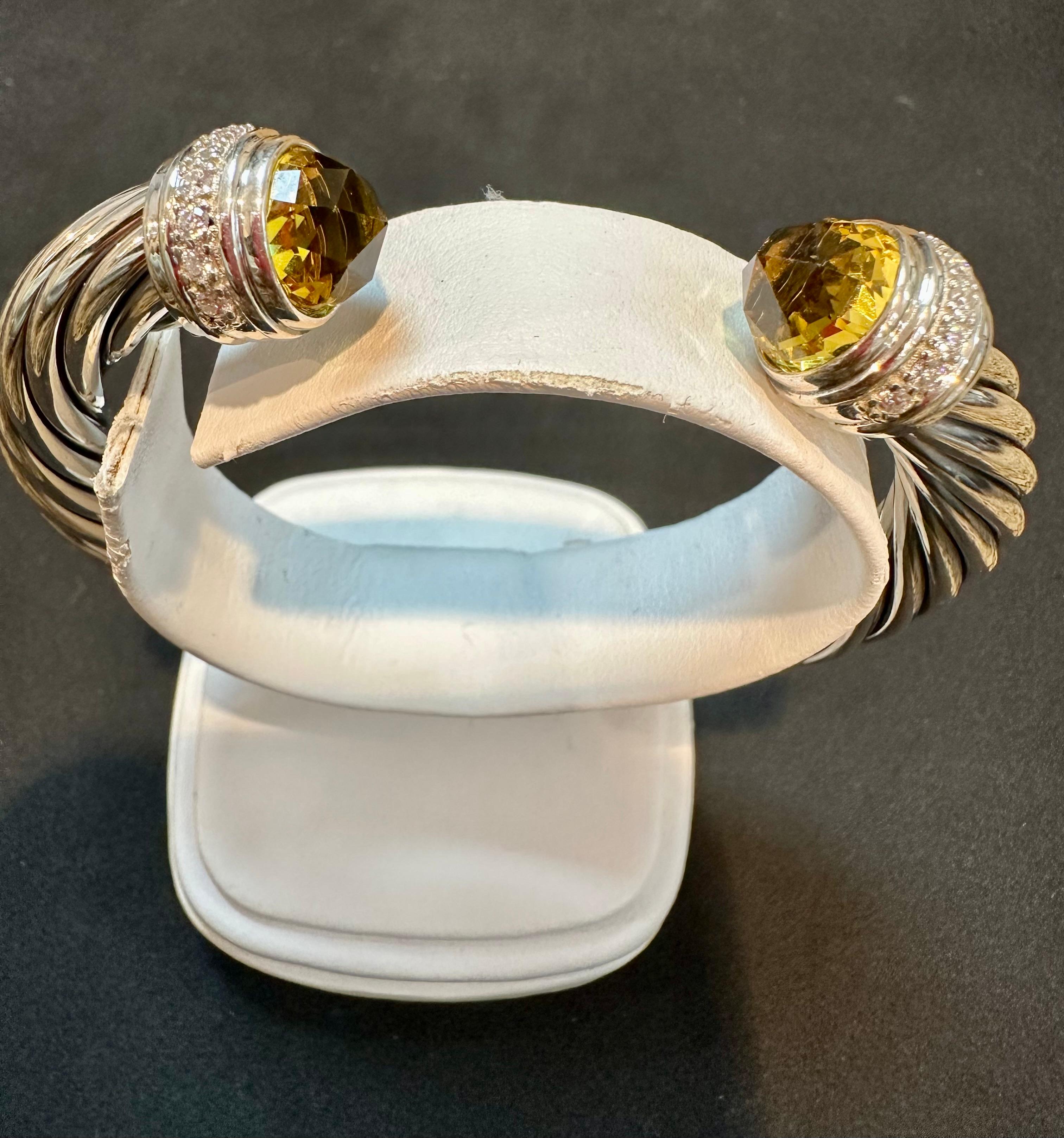 This pre-owned bangle is a beautiful piece of jewelry that showcases David Yurman's artistic signature style. Yurman's Cable design began as a bracelet that he hand-twisted from 50 feet of wire. Over the past 30 years, he has evolved the twisted