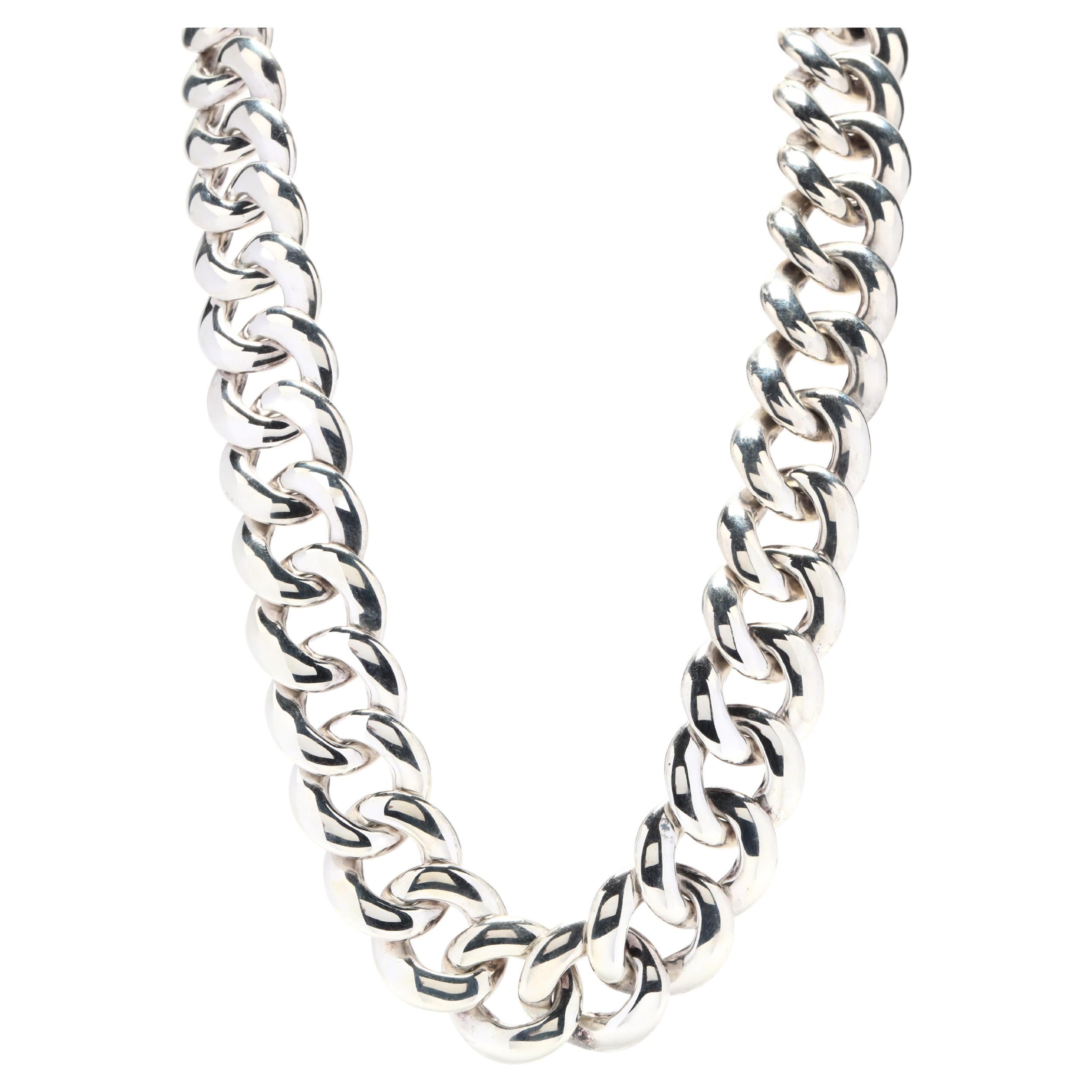 A vintage 14 karat yellow gold and sterling silver curb link chain by David Yurman. This chain features a wide curb link chain with a buckle motif clasp that has yellow gold accents.



Length: 18.5 in.



Width: 19 mm



Weight: 137.80 grams