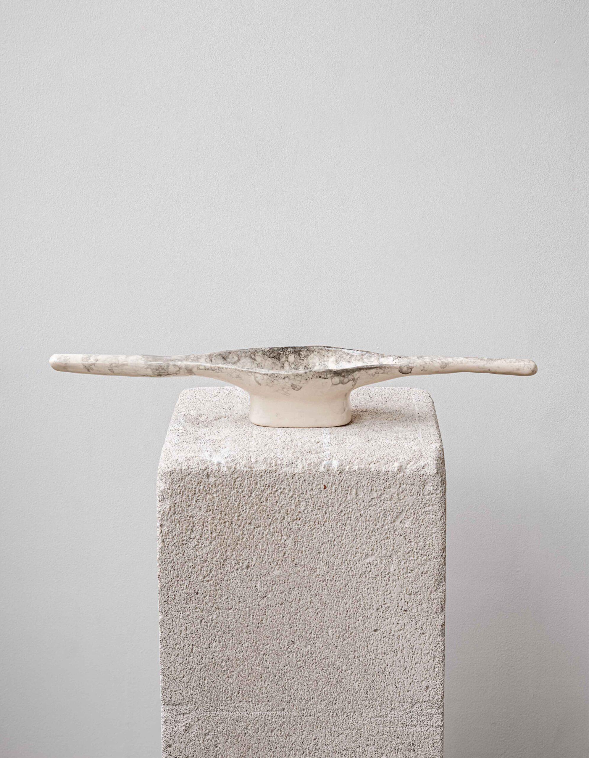 DYKA Drinking Bowl by ZEMNA
Designed by Tetiana Krasutska.
Dimensions: D 40 x W 40 x H 6 cm. 
Materials: Clay.

Each object in the DYKA collection is unique because it is sculpted by hand from white clay. They are finished using a glaze foaming