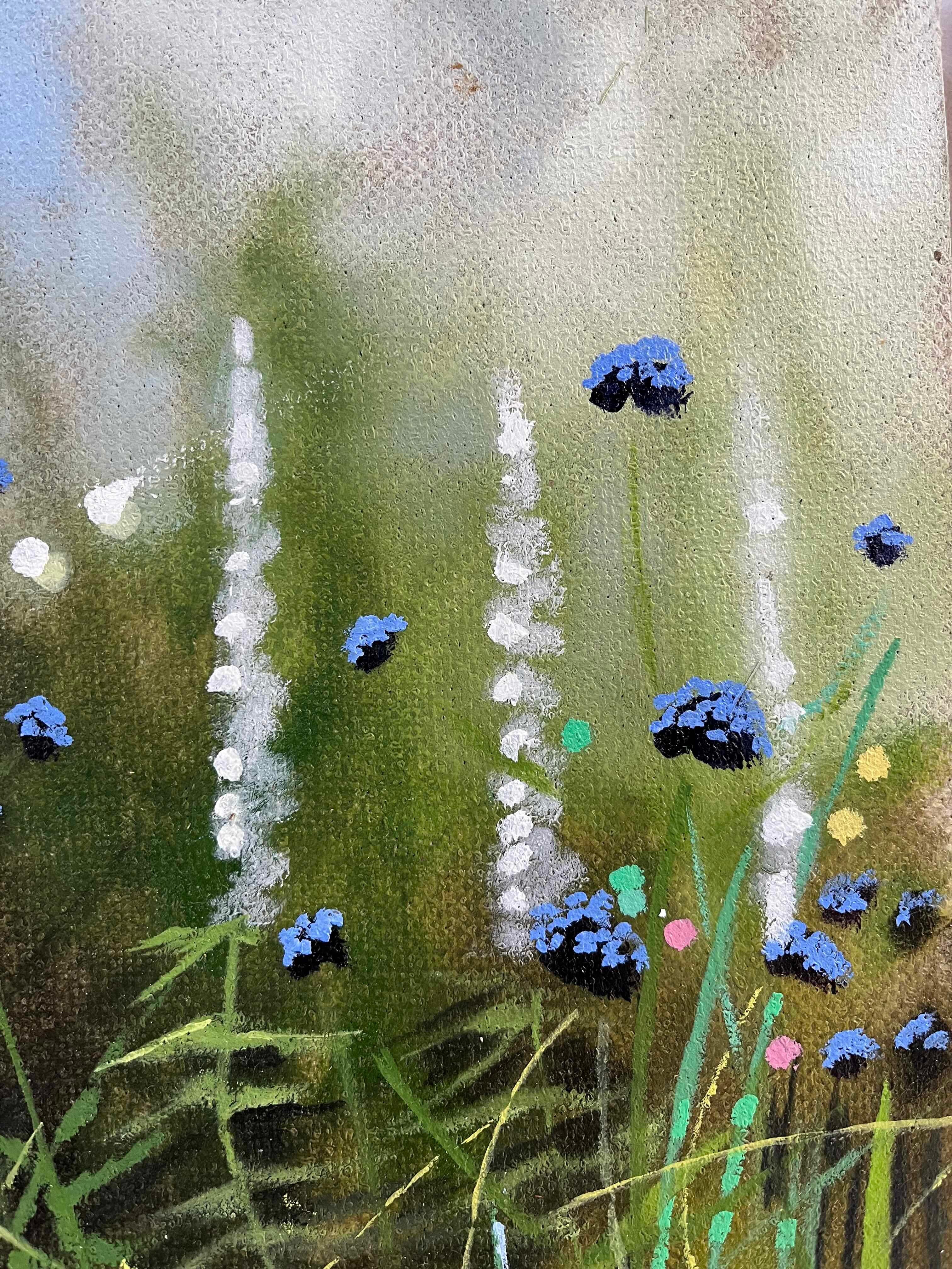  Garden Study 2022 is an original macro style realist painting by Dylan Lloyd, presenting a close up view of a wild garden in bloom. With beautiful blue purple and white flowers dotted around the foreground and a hazy blue background.

ADDITIONAL