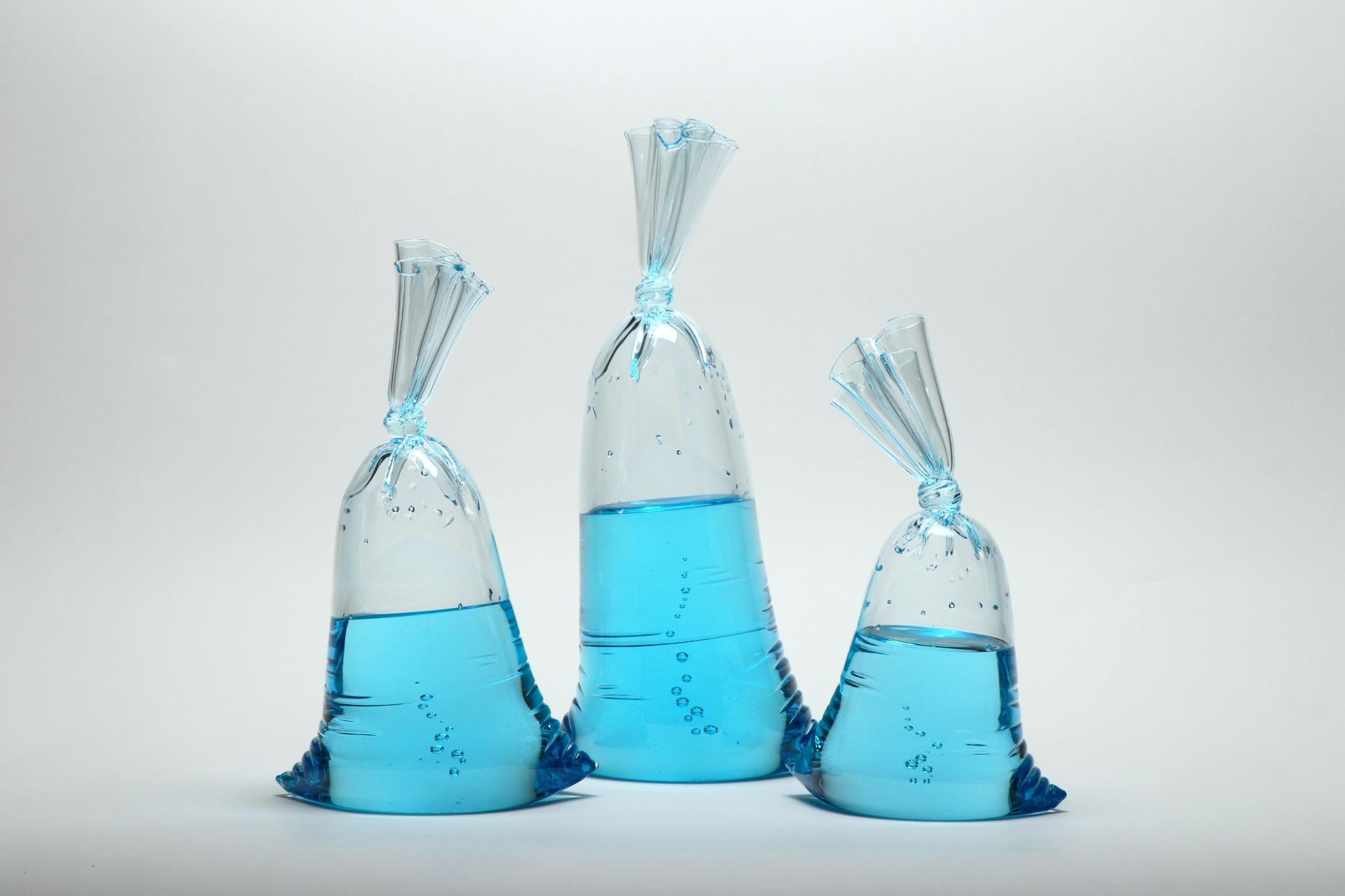 Blue Glass Water Bag Trio - Hyperreal glass sculpture installation