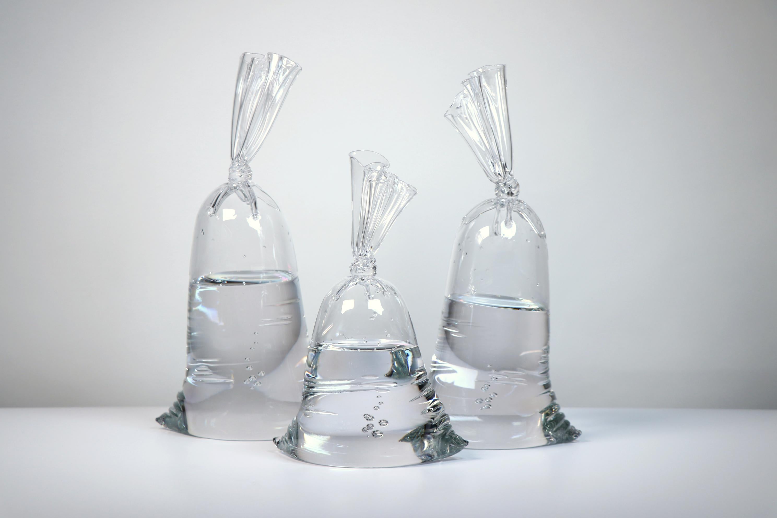Individual Sizes in Inches
15 x 8 x 5.5 (D10), 14.5 x 7 x 5 (D11), 11 x 7.5 x 5 (D12)

A hyper-realistic glass sculptor, Dylan
s playful creations deceive the eye with their lifelike appearance. Whether mimicking water balloons or plastic bags