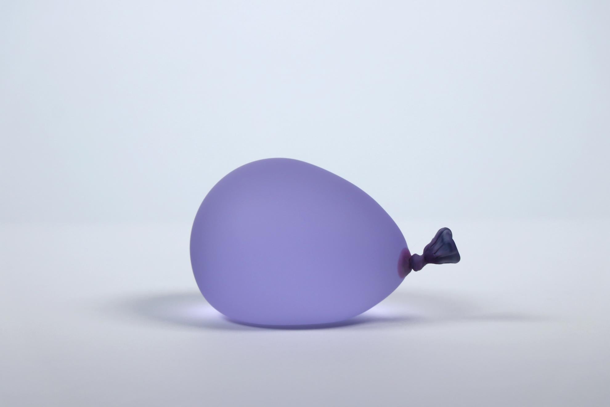 Hyperreal glass water balloon installation - Set of 4 sculptures (pale yellow, purple, blue and pink) by Dylan Martinez. 

These hyperrealistic water balloons are made of solid sculpted glass sandblasted and acid-etched to resemble real water