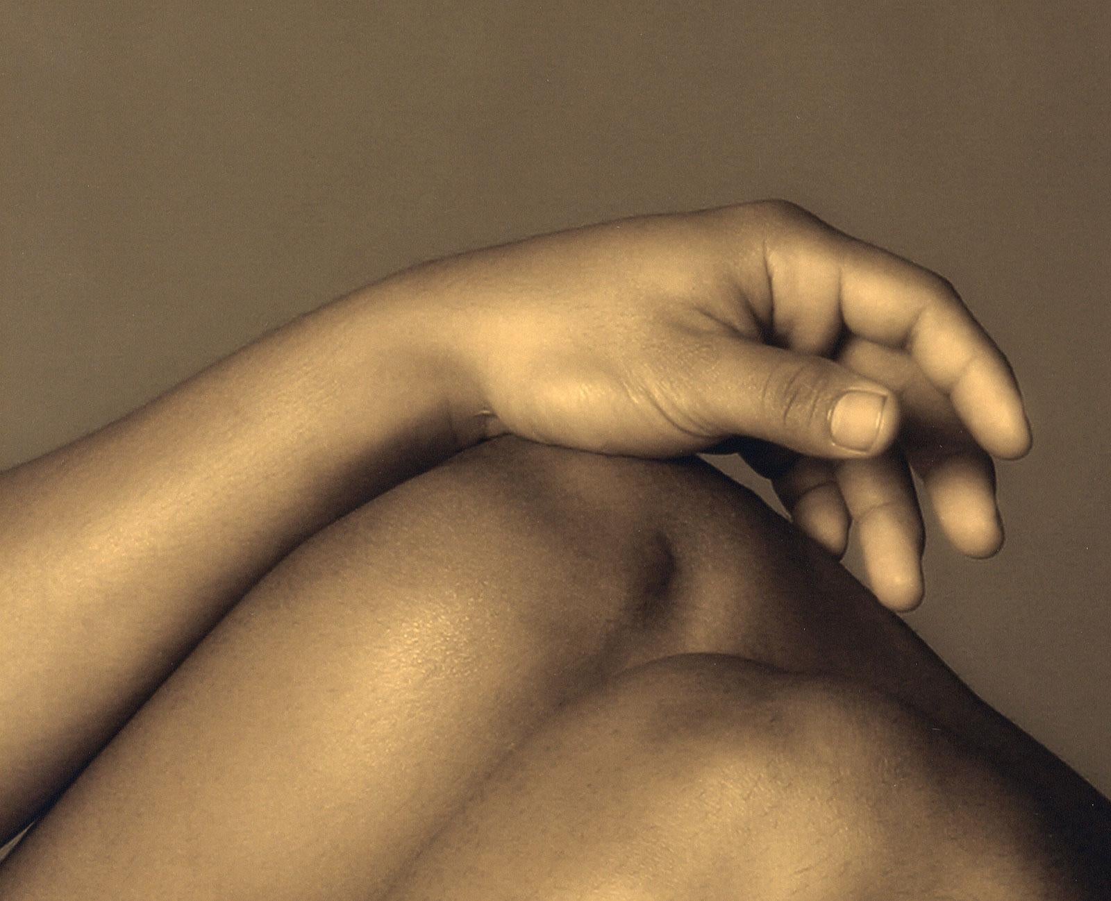 Male Nude #111 (a young nude male with his muscular legs drawn with hand atop) - Photograph by Dylan Ricci