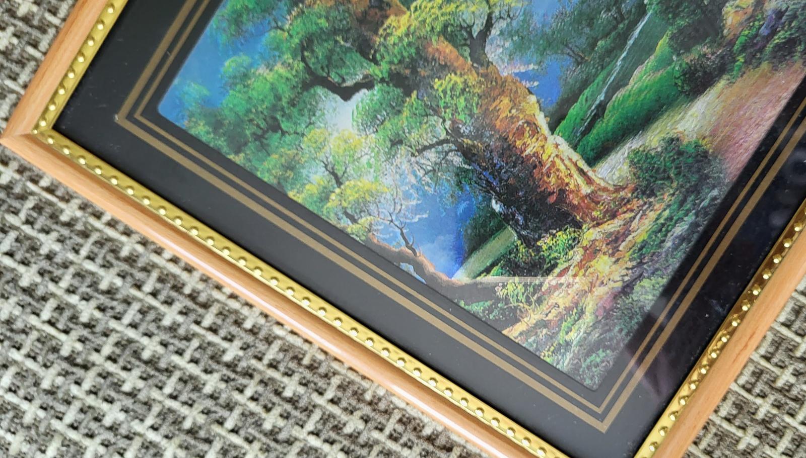 Immerse yourself in a mesmerizing visual experience with this vintage framed print from the 1990s. Featuring a shiny image that changes colors depending on the lighting, this captivating piece adds a touch of magic to any space.

The print is
