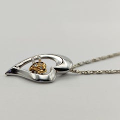 Dynamic Heart Diamond Pendant in 18K White and Yellow Gold