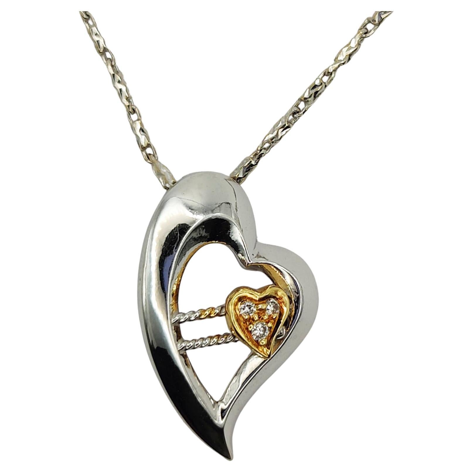 Dynamic Heart Diamond Pendant in 18K White and Yellow Gold For Sale