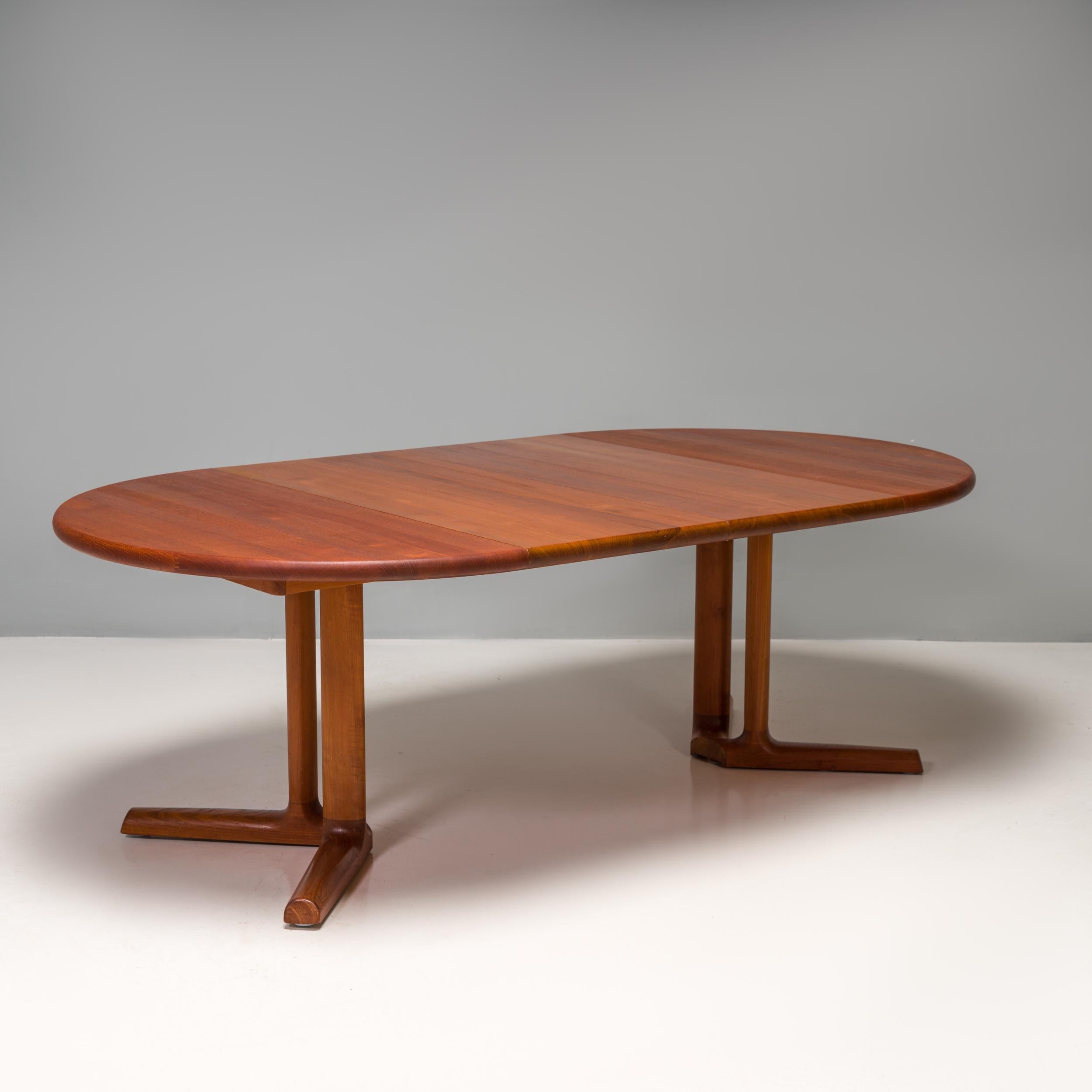 Designed and made by Dyrland in Denmark, this dining table is a Classic example of Mid-Century Modern design.

Constructed from teak, the dining table has a circular table top sitting on two sets of v-shaped legs, which create a four star base