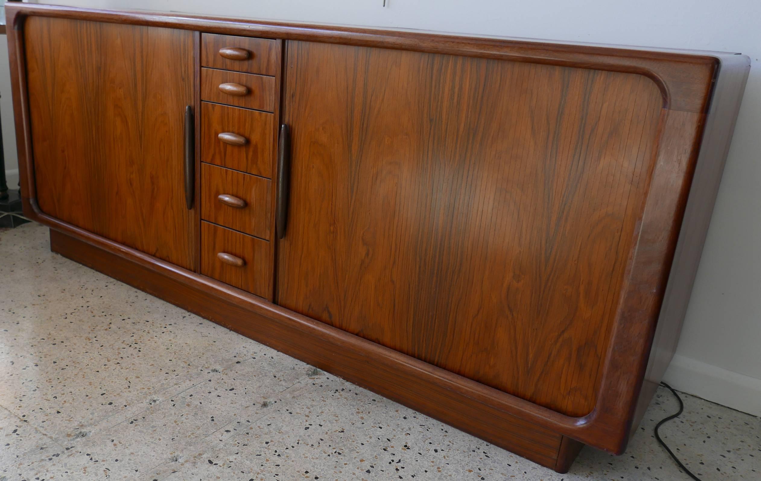 Dyrlund dresser credenza of rosewood from Denmark with tambor doors, circa 1970. Deep storage capacity. See companion dresser in our listings for his/her bedroom set.