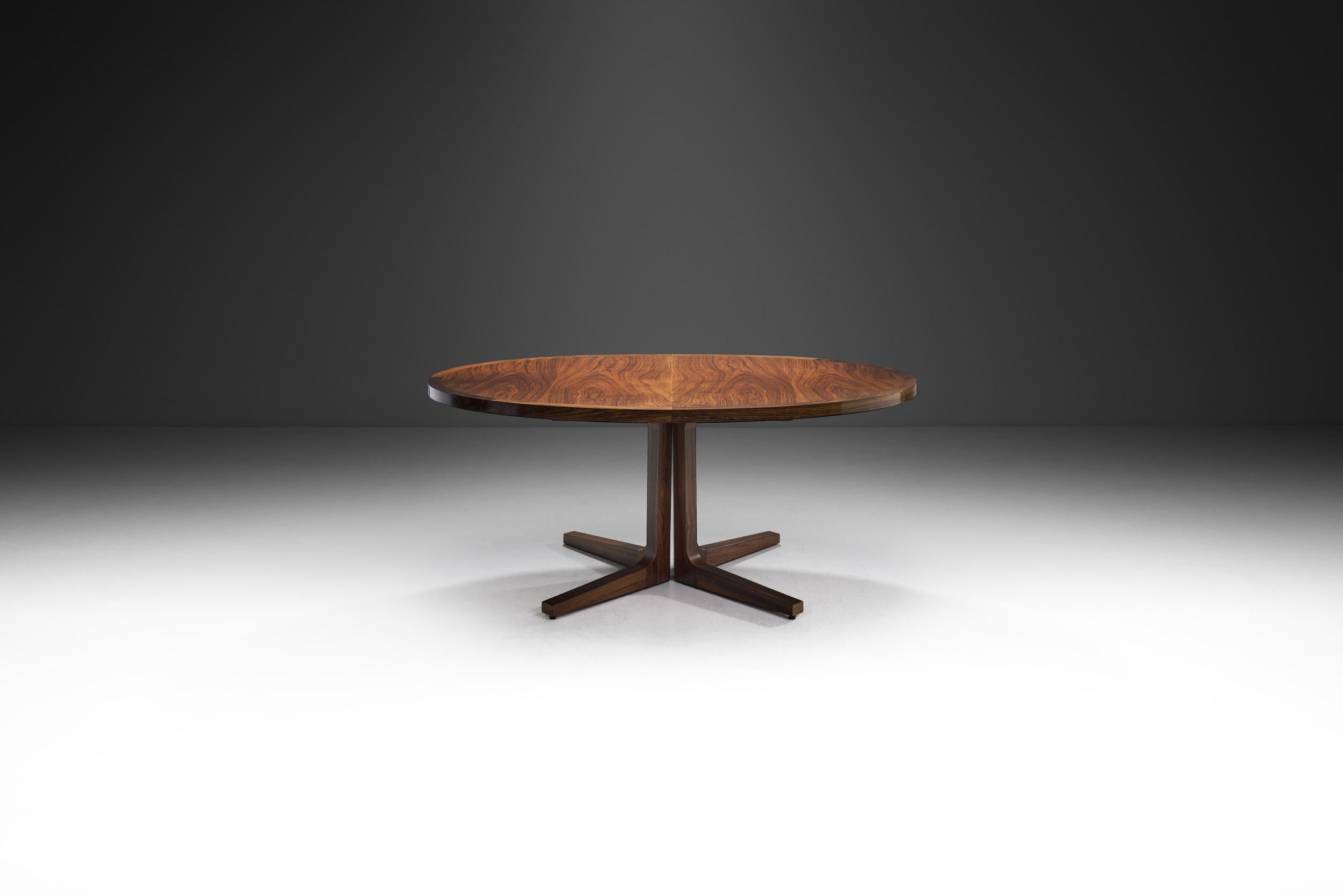 Precious woods and hand finishing define the furniture pieces made by the Danish company, Dyrlund. As this stunning table shows, great emphasis is placed on skilled craftsmanship with experts who work in the old craftsmanship style.

Using only