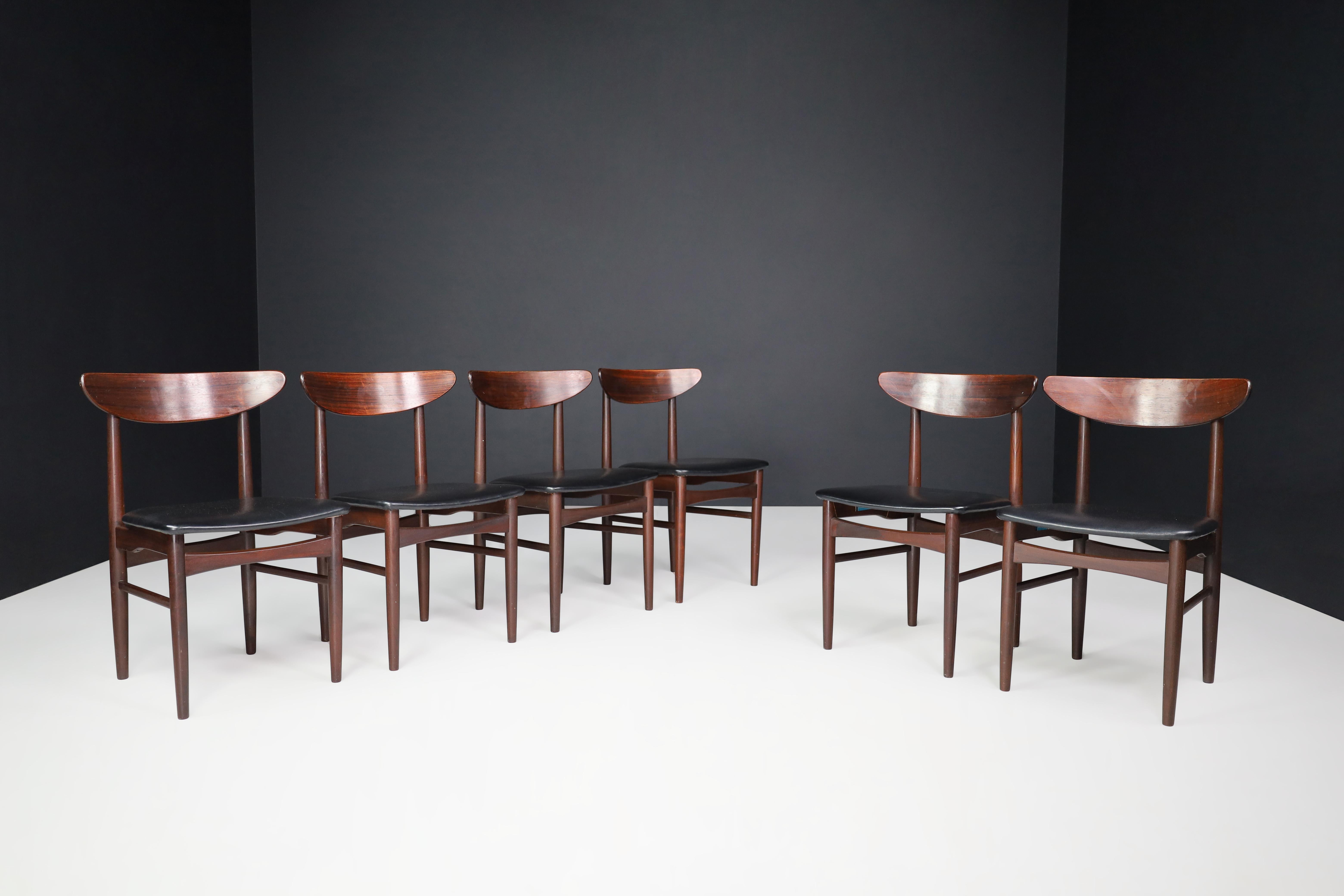 Dyrlund hardwood and black leather dining chairs, Denmark 1960s.

A set of six Danish midcentury dining chairs by Dyrlund with hardwood frames and original black leather upholstered seats. They are in excellent original condition. The color of the