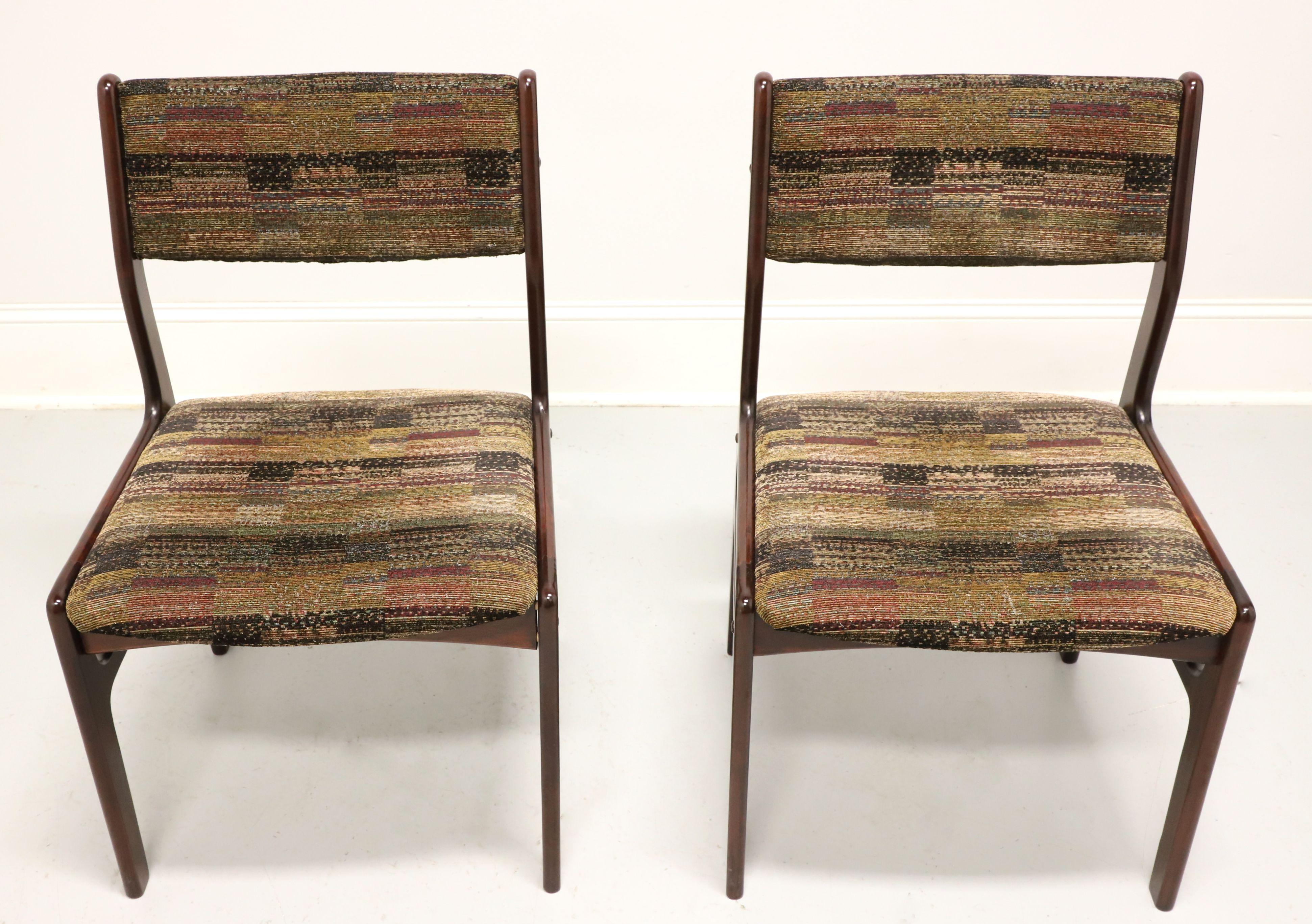A pair of Danish Modern dining side chairs by Dyrlund. Solid rosewood with curved backrest, multi-color earth tones tweed-like fabric upholstered backrest & seat, upper side stretchers and straight legs. Made in Denmark, in the mid 20th