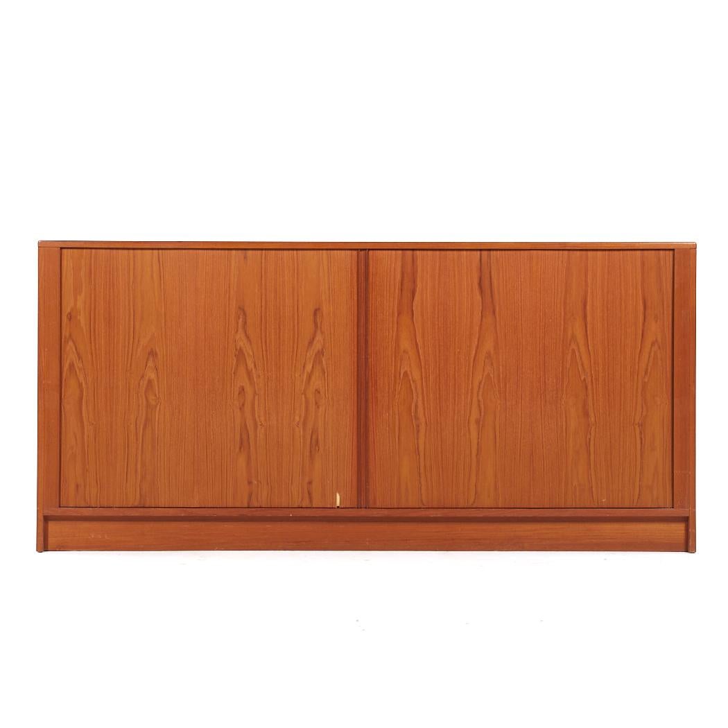 Dyrlund Mid Century Danish Teak Tambour Door Lowboy Dresser

This lowboy measures: 71 wide x 17.75 deep x 33.5 inches high

All pieces of furniture can be had in what we call restored vintage condition. That means the piece is restored upon purchase