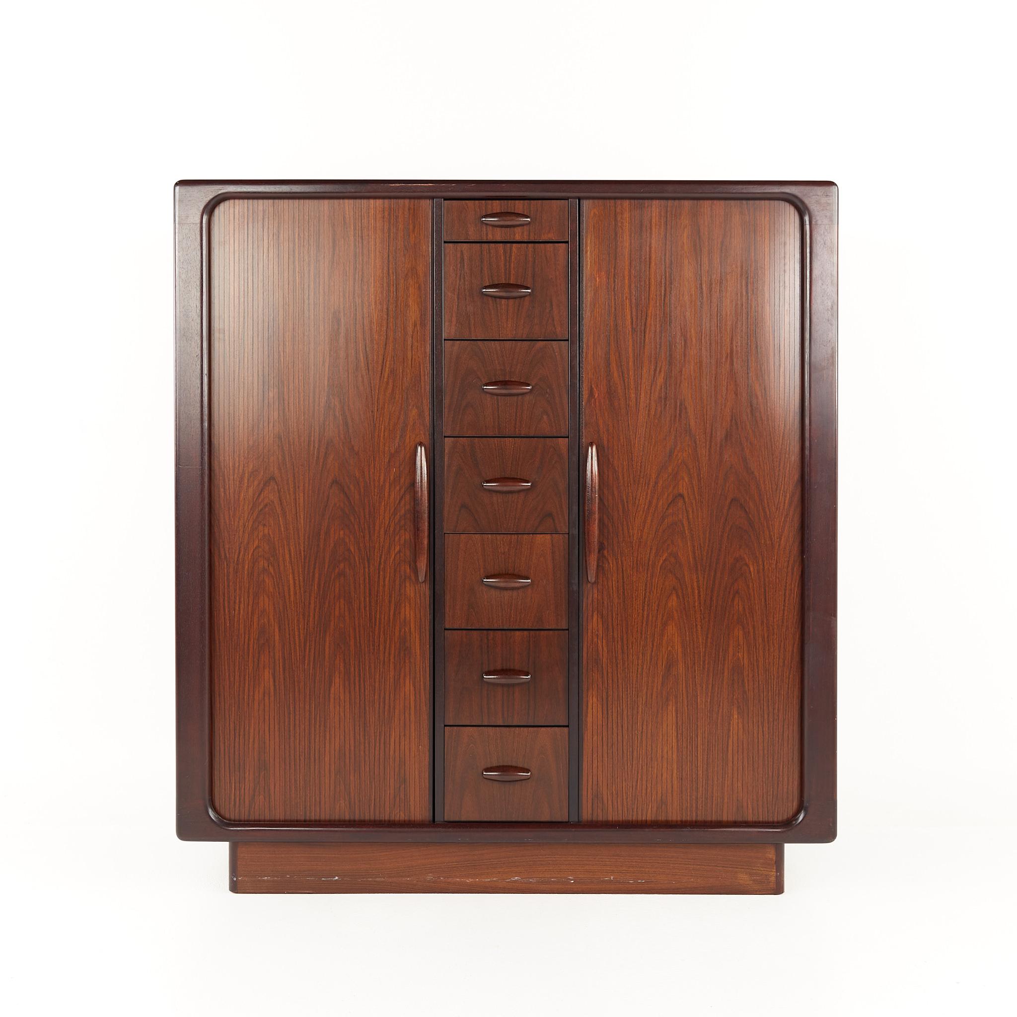 Dyrlund Mid Century rosewood tambour door highboy dresser armoire

The armoire measures: 48 wide x 19 deep x 52 inches high

All pieces of furniture can be had in what we call restored vintage condition. That means the piece is restored upon