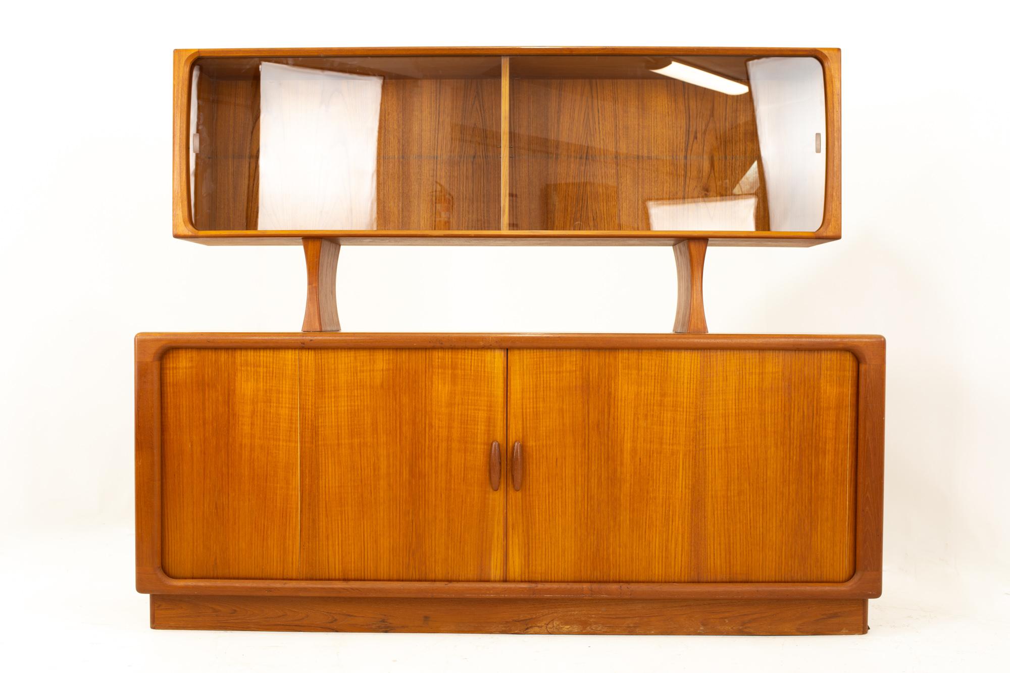 Dyrlund midcentury teak plinth base tambour door credenza with glass front hutch
Credenza measures: 74.5 wide x 19 deep x 30 high
Hutch measures: 71 wide x 12.5 deep x 30 high
Credenza and hutch together measures: 74.5 wide x 19 deep x 60