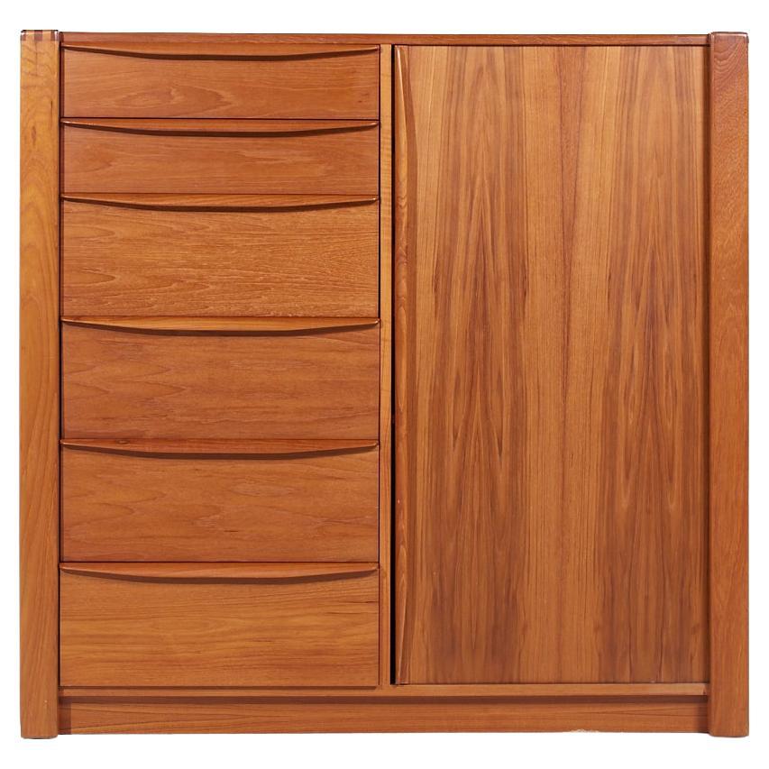 Dyrlund Mid Century Teak Tambour Door Armoire

This armoire measures: 49.75 wide x 19 deep x 48.25 inches high

All pieces of furniture can be had in what we call restored vintage condition. That means the piece is restored upon purchase so it’s