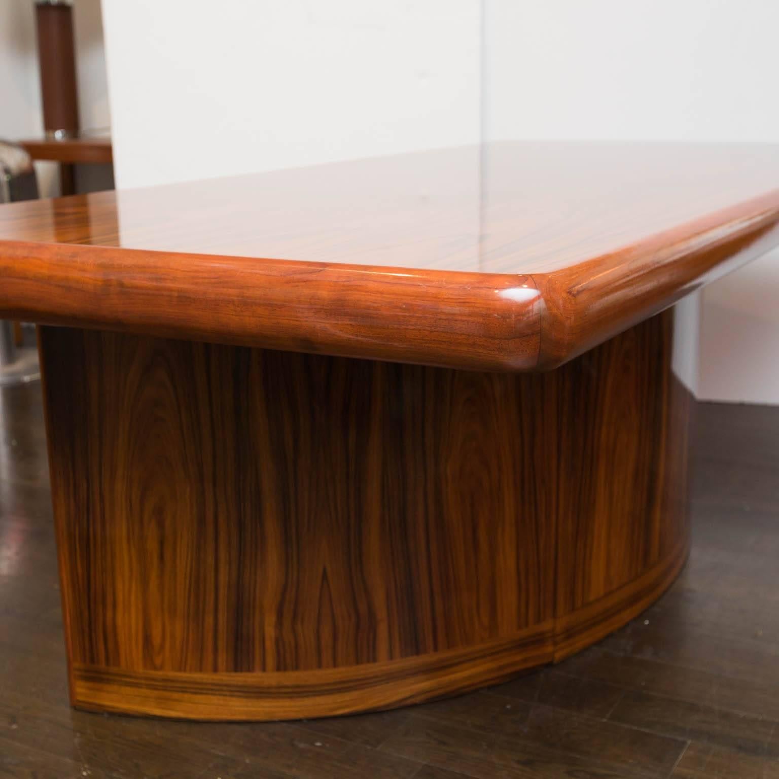 This Danish modern desk will make a dramatic statement in any office. Room for multiple computer monitors with which to keep tabs on the Empire. A writing shelf is flanker right and left with beautiful rosewood finished drawers. This was the top of