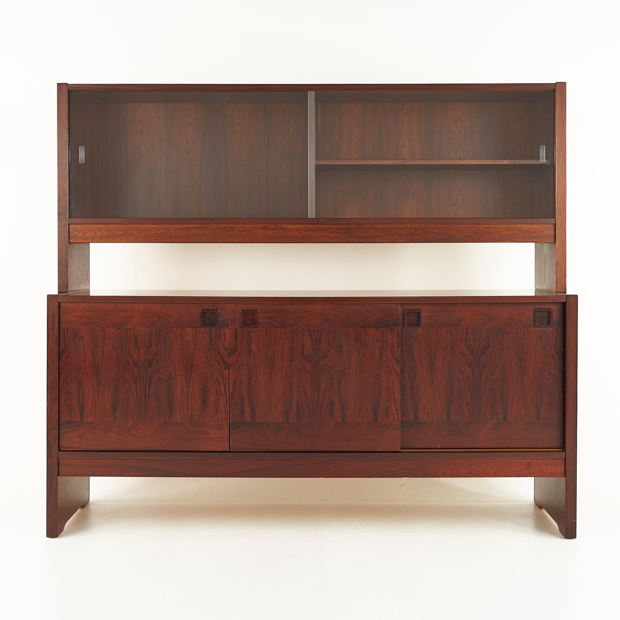 Dyrlund style mid century rosewood buffet and hutch

This buffet measures: 64.25 wide x 12.25 deep x 26.75 inches high

This hutch measures: 64.25 wide x 18 deep x 30 inches high, with a total combined height of 56.75 inches

All pieces of