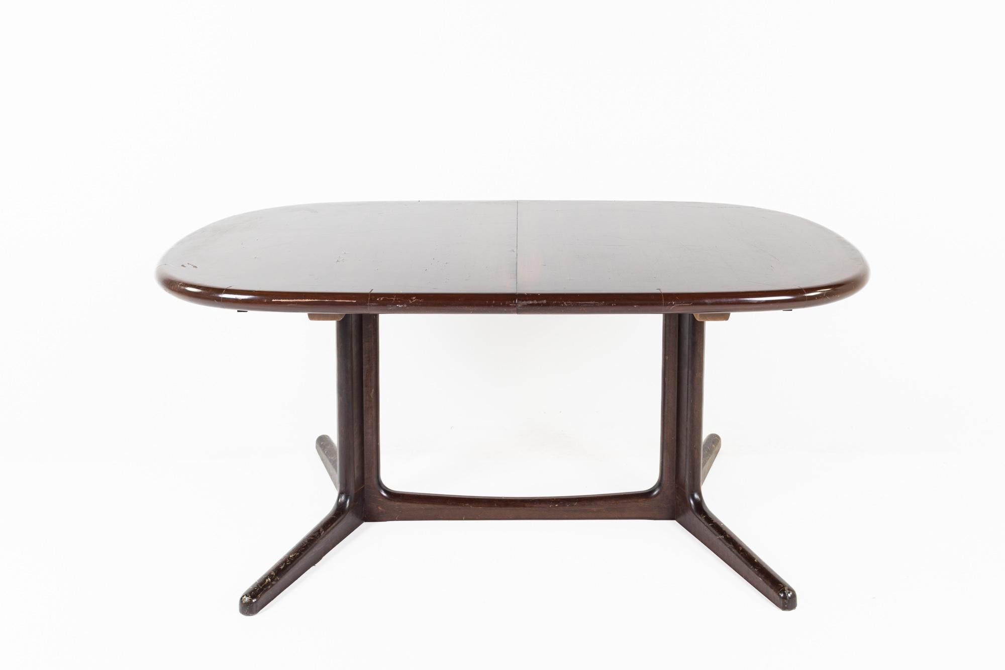 Dyrlund style mid century rosewood dining table

This table measures: 63.5 wide x 41 deep x 28 inches high, with a chair clearance of 26 inches

All pieces of furniture can be had in what we call restored vintage condition. That means the piece