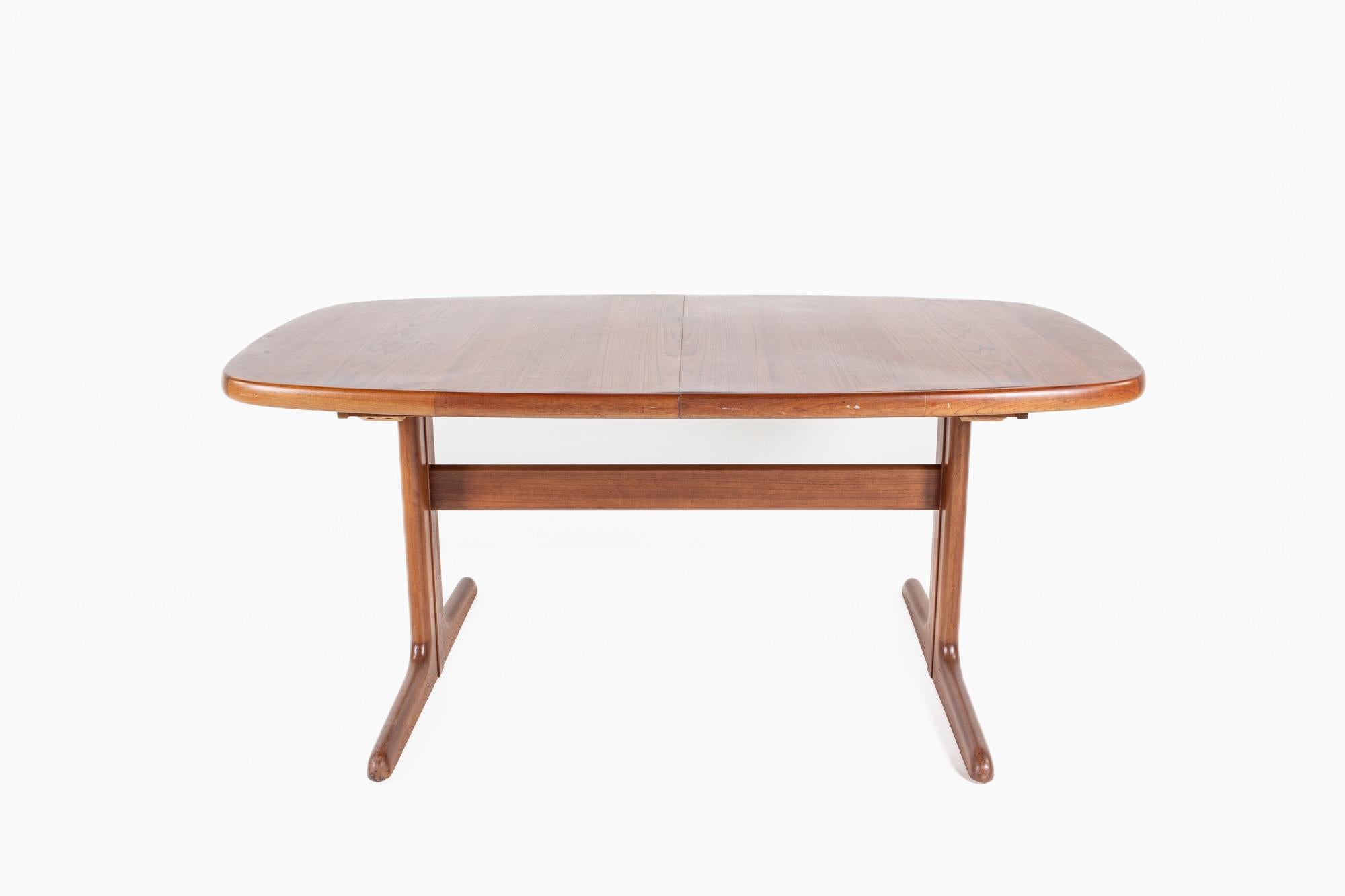 Dyrlund style mid century teak dining table

The table measures: 65 wide x 40 deep x 28 high, with a chair clearance of 26.5 inches 

All pieces of furniture can be had in what we call restored vintage condition. That means the piece is restored