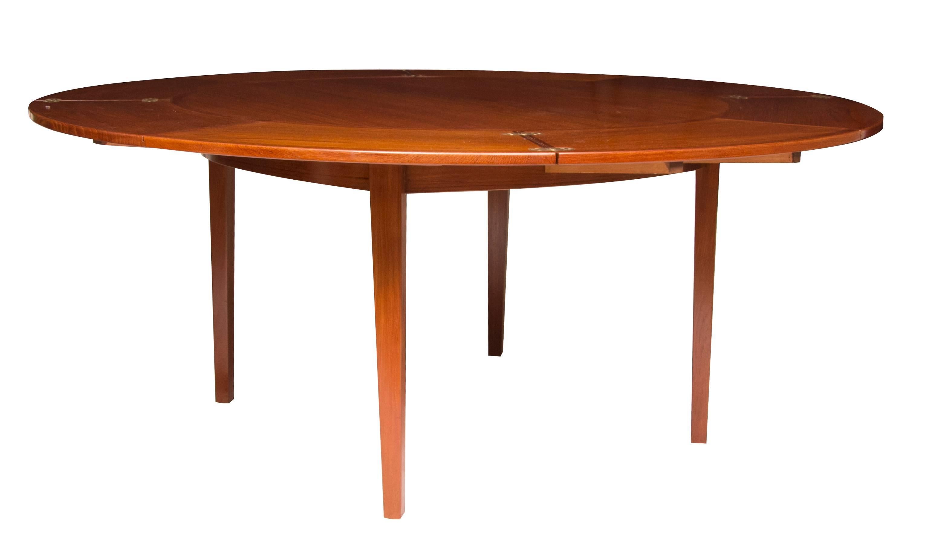 Midcentury teak Dyrlund flip flap dining table. Ingenius Radial extending table measuring 120cm extending to 176 cm when open.