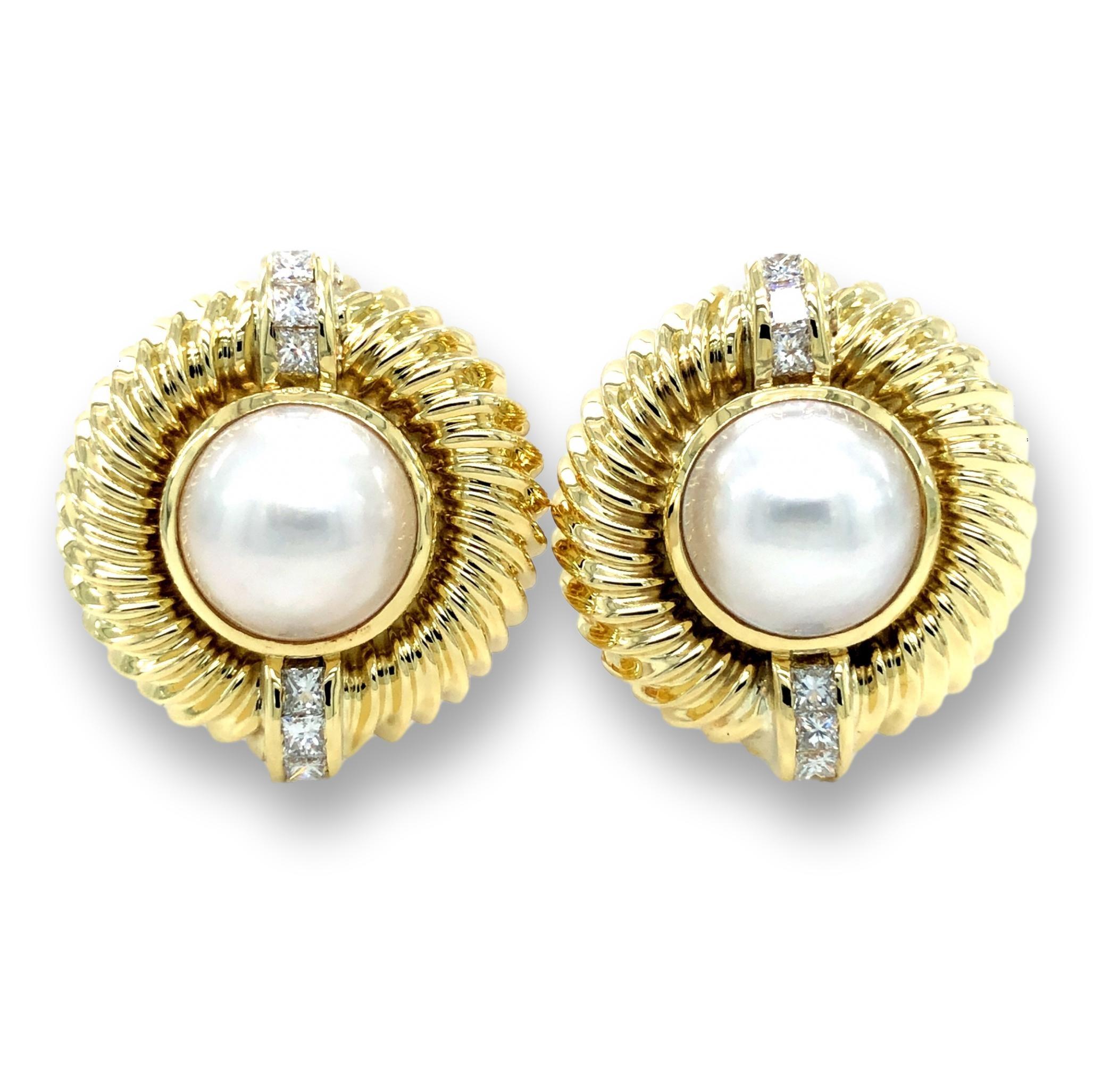 David Yurman vintage earrings finely crafted in 14 karat yellow gold featuring two 10 mm mabe pearl centers set in bezels and 6 princess cut diamond accents on each earring weighing 0.65 cts total weight approximately.  Earrings have a twist cable