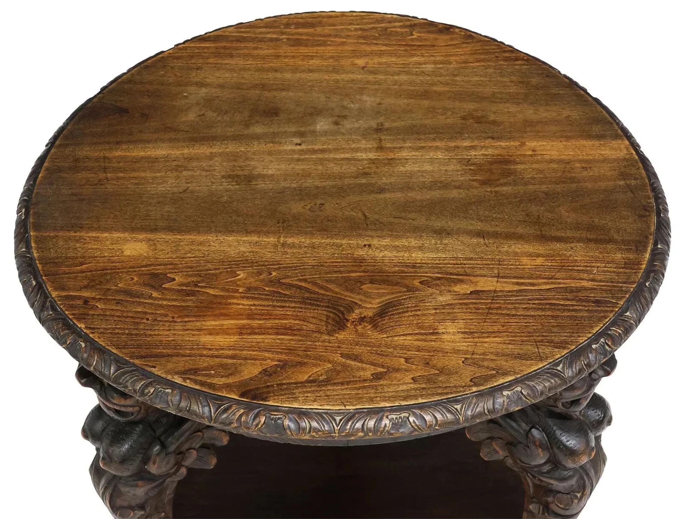 Stunning Antique Table, Occasional, Carved, Roundtop, Renaissance Revival, early 1900s, 20th Century!

This antique roundtop Renaissance Revival table from the early 1900s is a beautifully crafted piece with carved wood detailing and winged