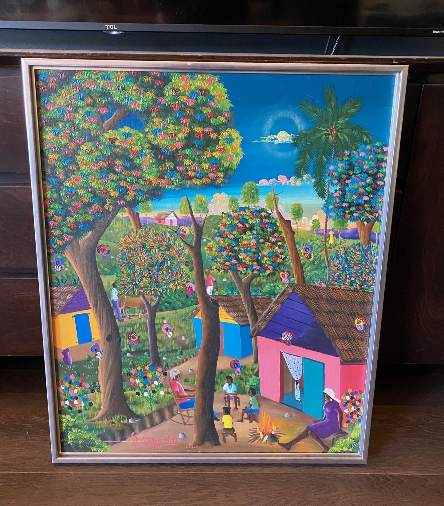 Une belle peinture d'art populaire originale et complexe de l'artiste haïtien E. A. (Angel) Othello.  Cette œuvre représente une scène de village tranquille avec des habitants de la région aperçus dans la campagne.  Les couleurs (remarquez les