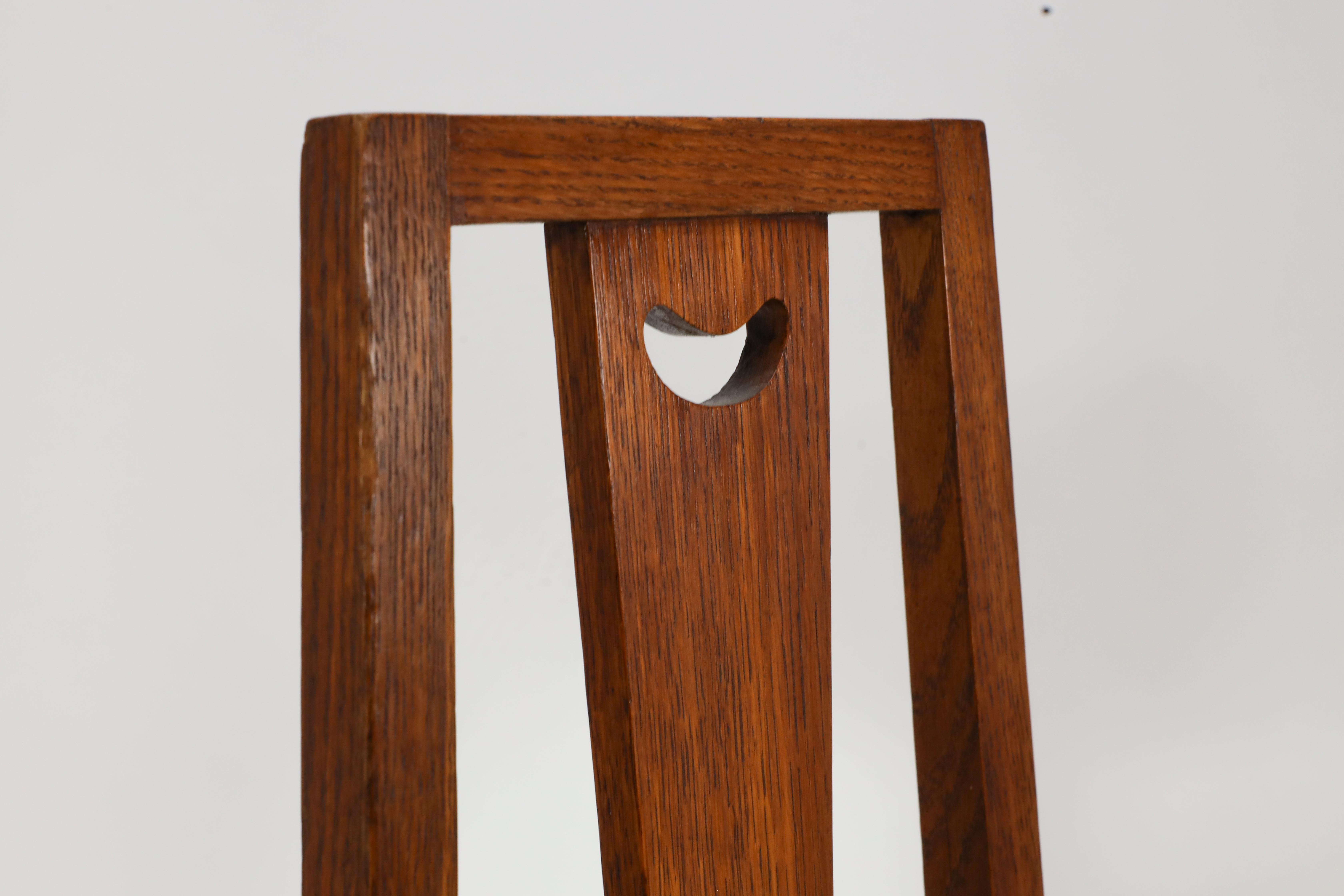 E A Taylor. A set of five Arts and Crafts oak side chairs with heart cut-outs. For Sale 4