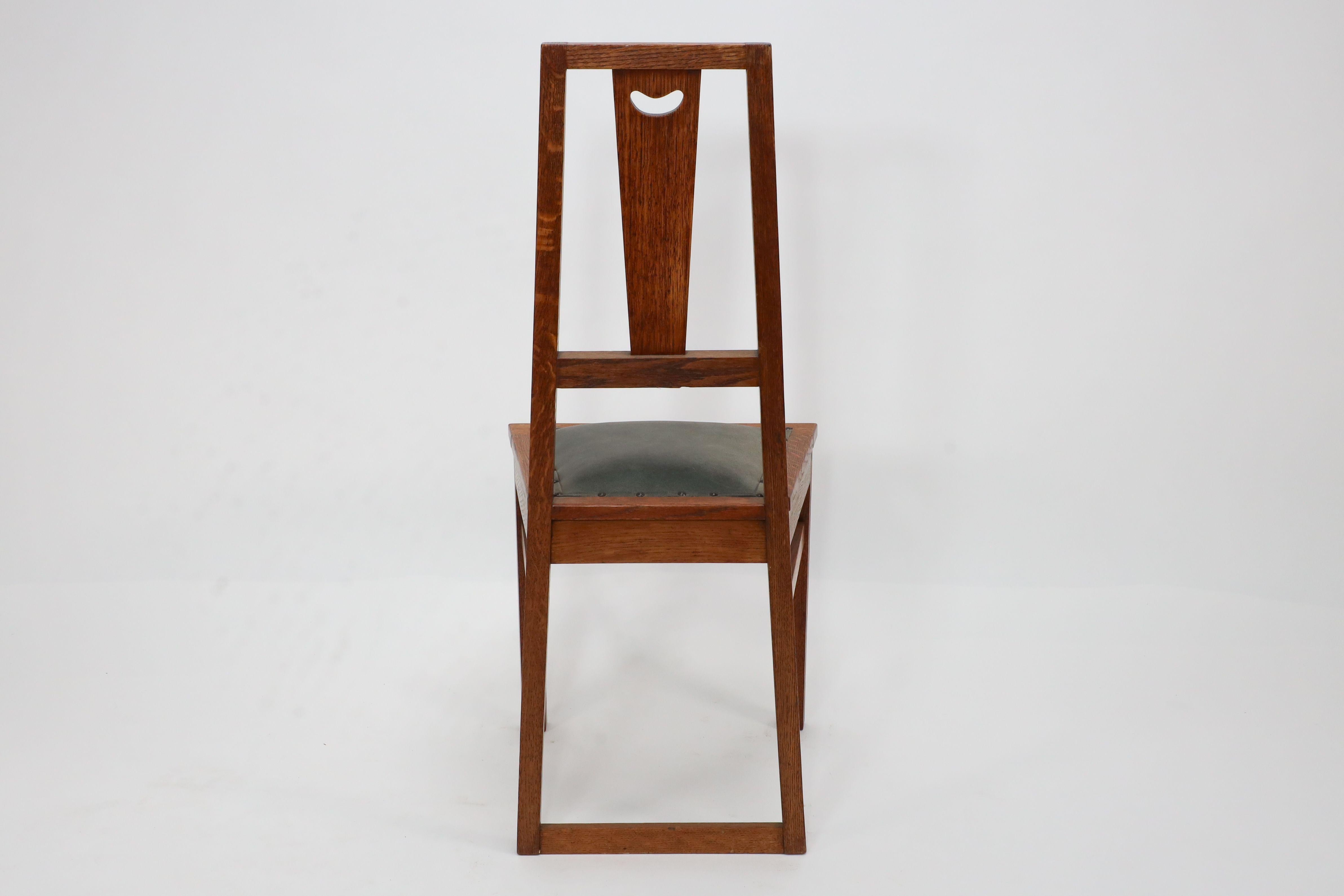 Leather E A Taylor. A set of five Arts and Crafts oak side chairs with heart cut-outs. For Sale