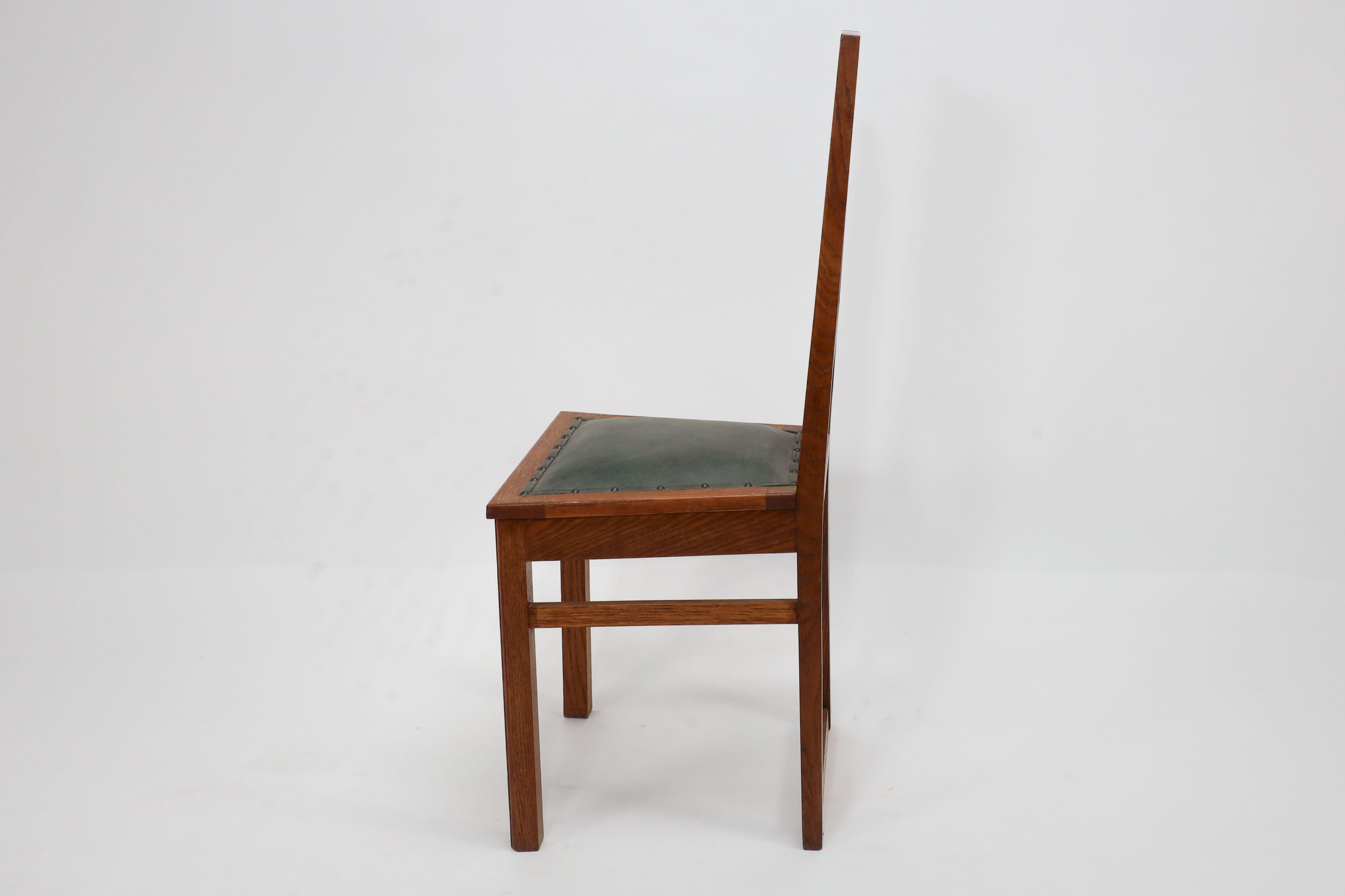 E A Taylor. A set of five Arts and Crafts oak side chairs with heart cut-outs. For Sale 1