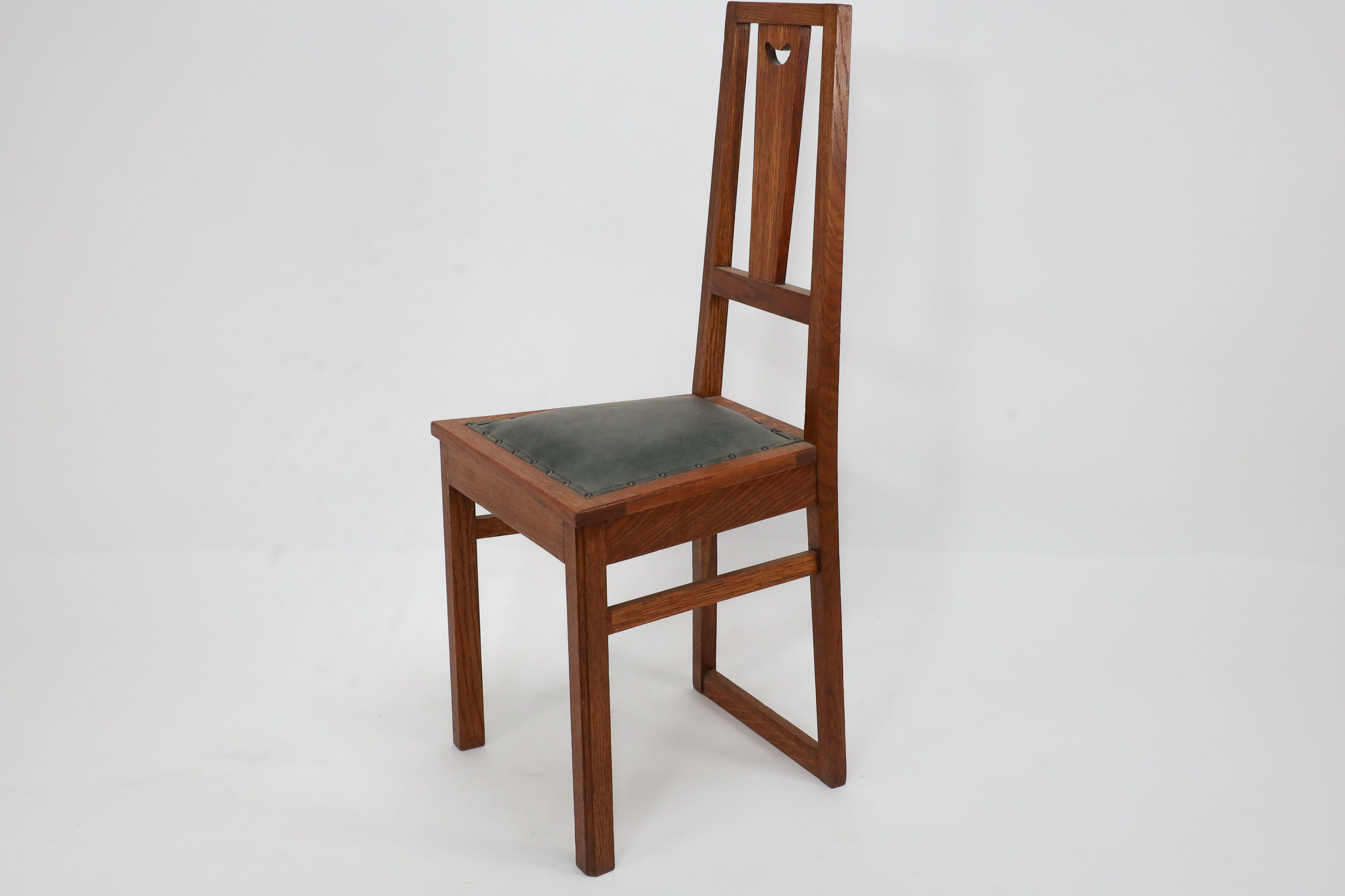 E A Taylor. A set of five Arts and Crafts oak side chairs with heart cut-outs. For Sale 2