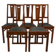 Antique E A Taylor. A set of five Arts and Crafts oak side chairs with heart cut-outs.