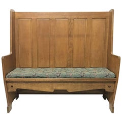 E A Taylor Attr, an Arts & Crafts Oak High Back Settle with Twin Heart Cut-Outs