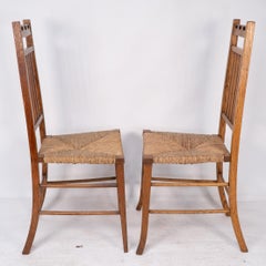 E A Taylor attri for Wylie & Lochhead. A pair of Arts & Crafts side chairs