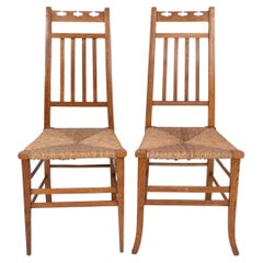 Antique E A Taylor attri for Wylie & Lochhead. A pair of Arts & Crafts side chairs
