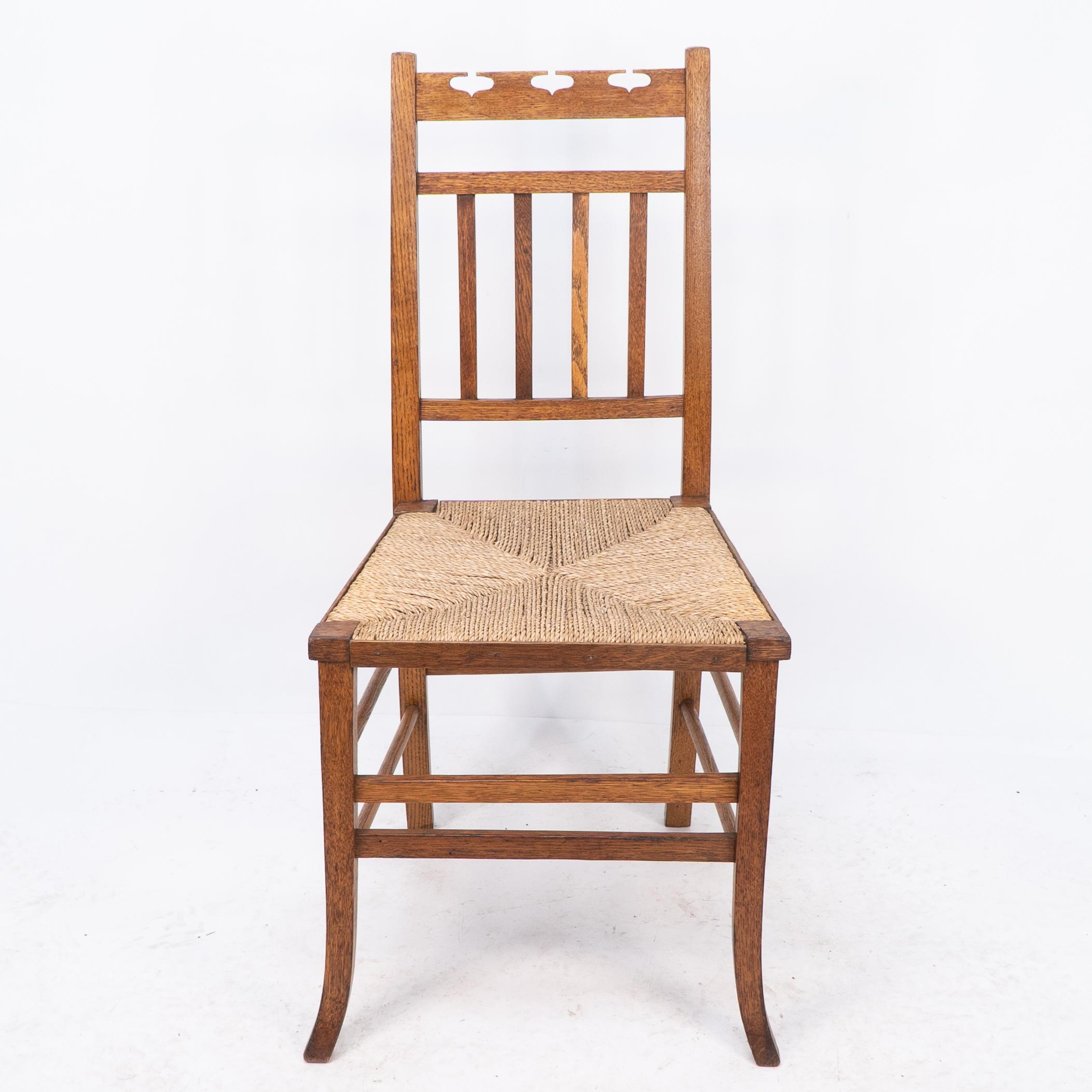 E A Taylor attributed for Wylie and Lochhead.  An Arts & Crafts rush seated side or bedroom chair. Professionally restored and recently re rushed.