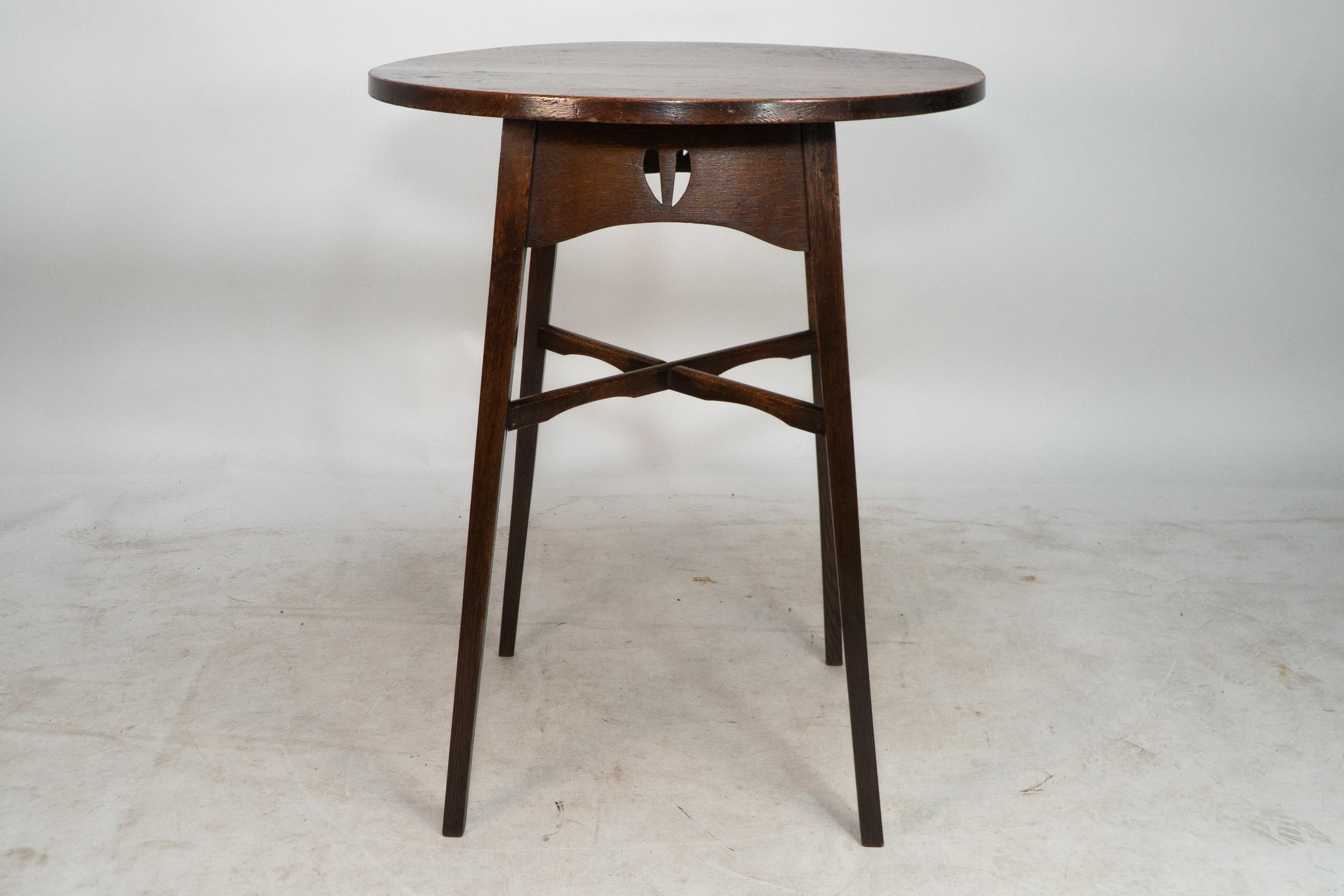 Arts and Crafts E A Taylor for Wylie and Lochhead. A Glasgow school circular oak side table For Sale