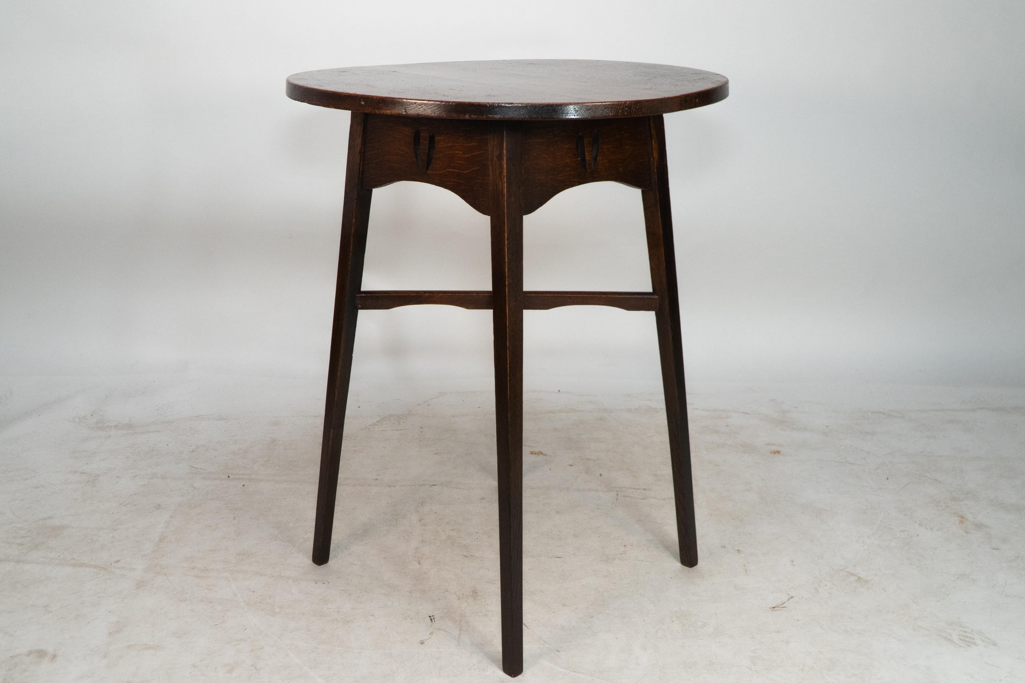 English E A Taylor for Wylie and Lochhead. A Glasgow school circular oak side table For Sale