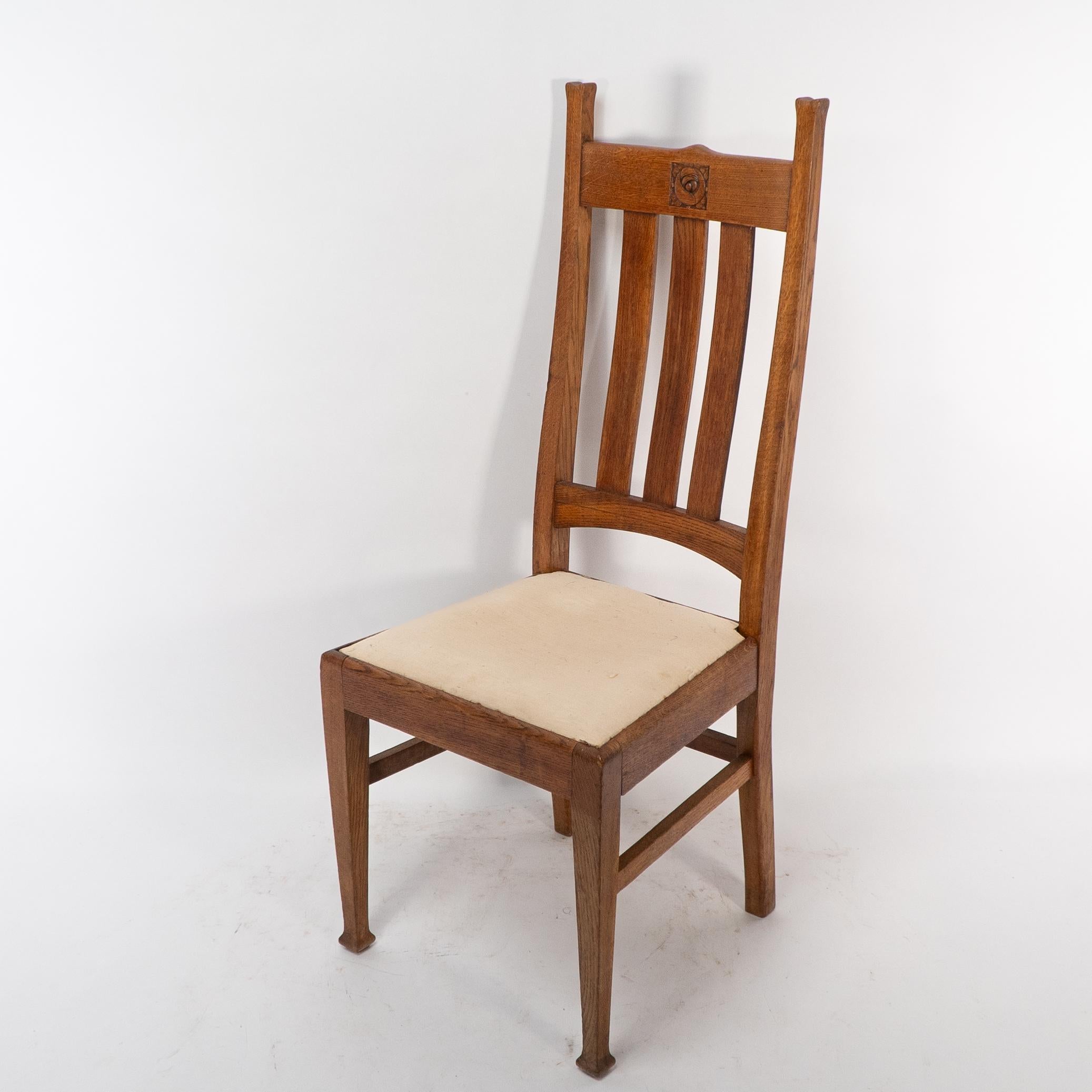 English E A Taylor for Wylie & Lochhead. A set of four Arts and Crafts oak dining chairs For Sale