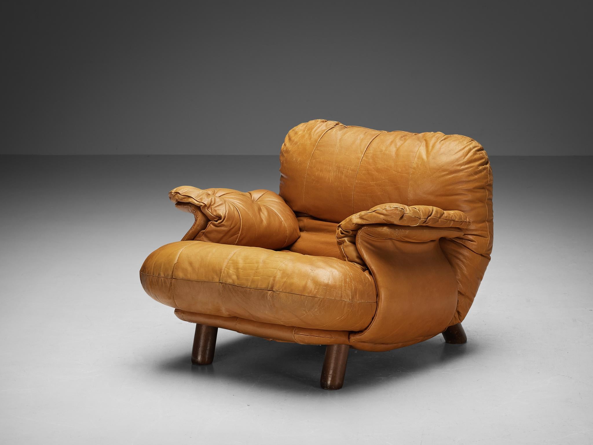 E. Cobianchi for Insa Italy, lounge chair, leather, wood, Italy, 1970s

A bulky and cloud-like lounge chair by E. Cobianchi for Italian manufacturer Insa, designed in the 1970s. This chair features thick, tufted seats and backrests. The armrests are