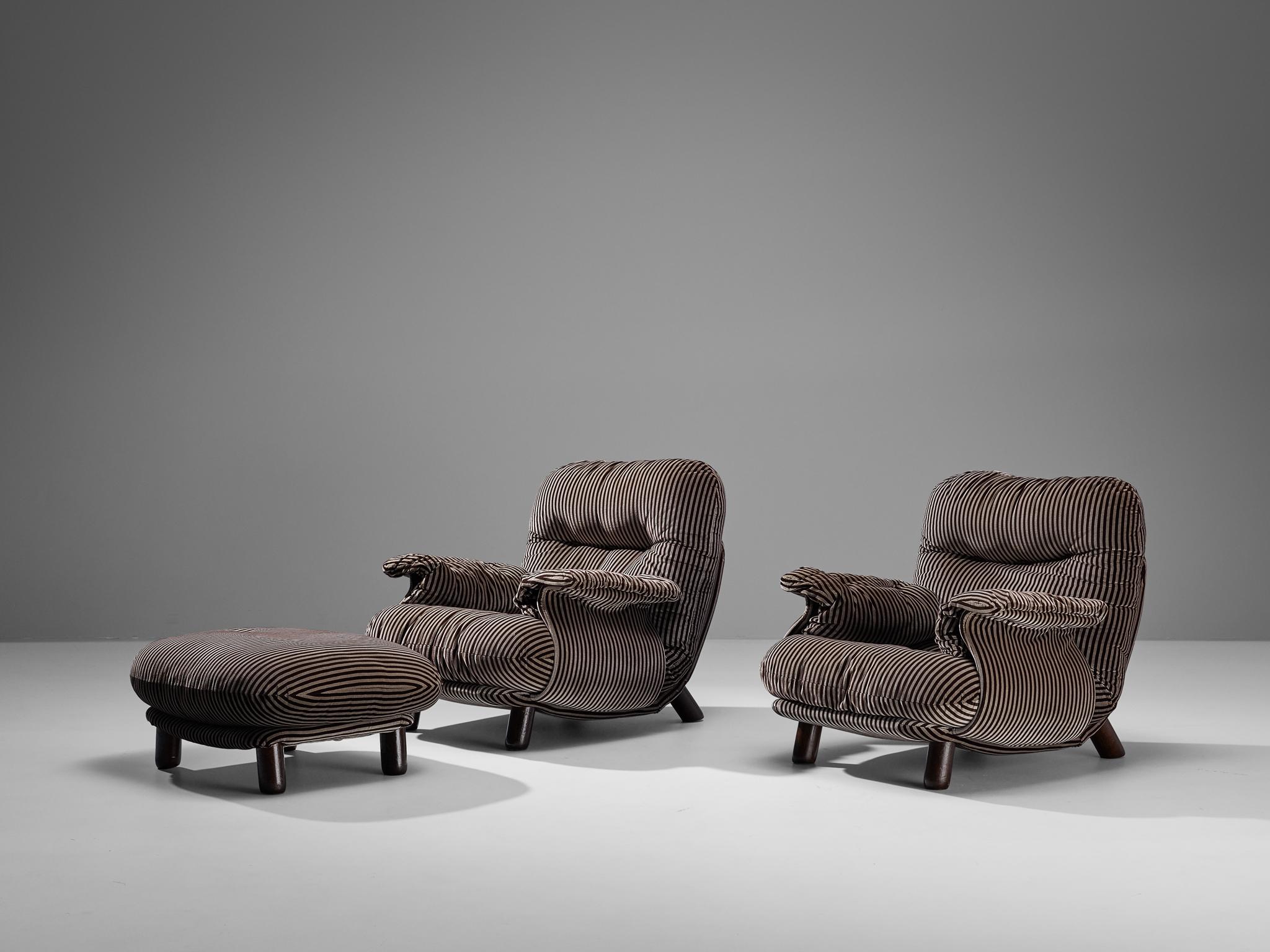 E. Cobianchi for Insa, pair of lounge chairs with ottoman, fabric, stained wood, Italy, 1970s

An Italian set of two bulky lounge chairs and ottoman designed by E. Cobianchi. The lounge chairs feature thick, tufted seats and backrests. The armrests