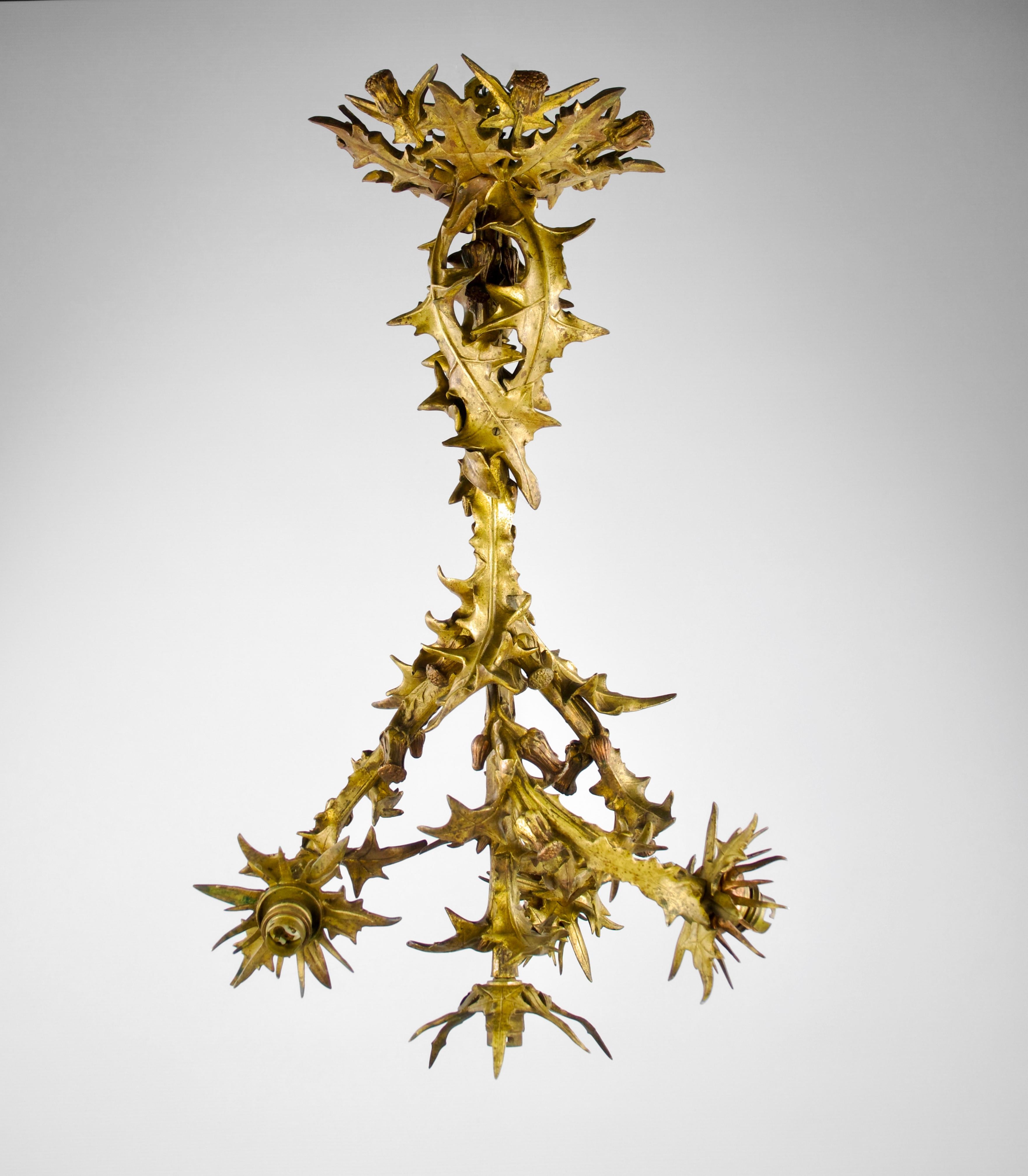 Magnificent gold and orange patina bronze Art Nouveau thistle chandelier by the Emile Colin & Cie manufacture, France circa 1882-1898. Stamp of the manufacture present indicating its period of production.

Very good condition. Natural oxidation seen