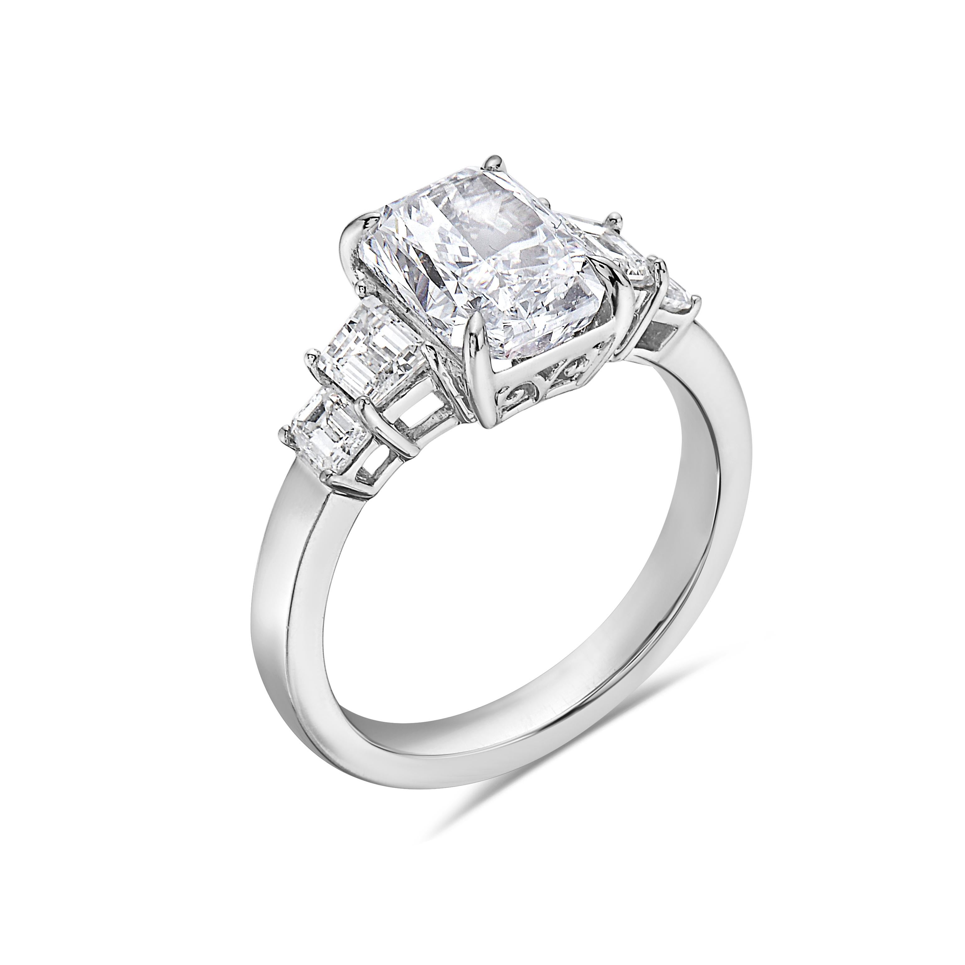 Metal: 18k  White Gold
Diamond: E Diamond Cut VVS1 
Diamond Shape: Emerald Cut
Diamond Carat Total Weight:2.90ctw
Diamond: White Diamond 
Diamond Shape: Round
Diamond Carat Total Weight:0.87 ctw
Size:7