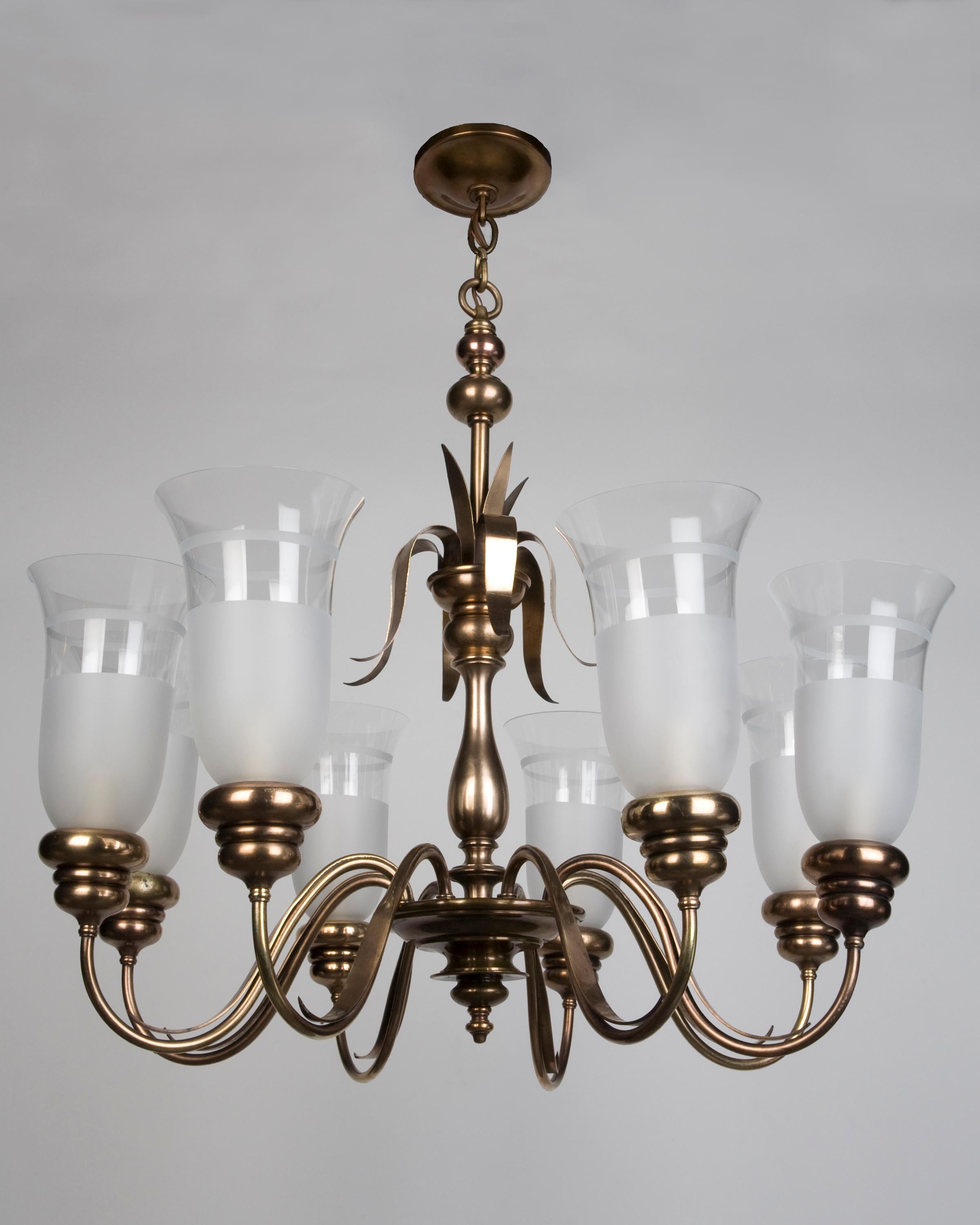 AHL3551

A vintage eight arm aged brass chandelier with frosted glass hurricane shades. The column and the arms are detailed with delicate scrolls. Signed by the New York maker E. F. Caldwell.

DIMENSIONS: 
Current height: 60
