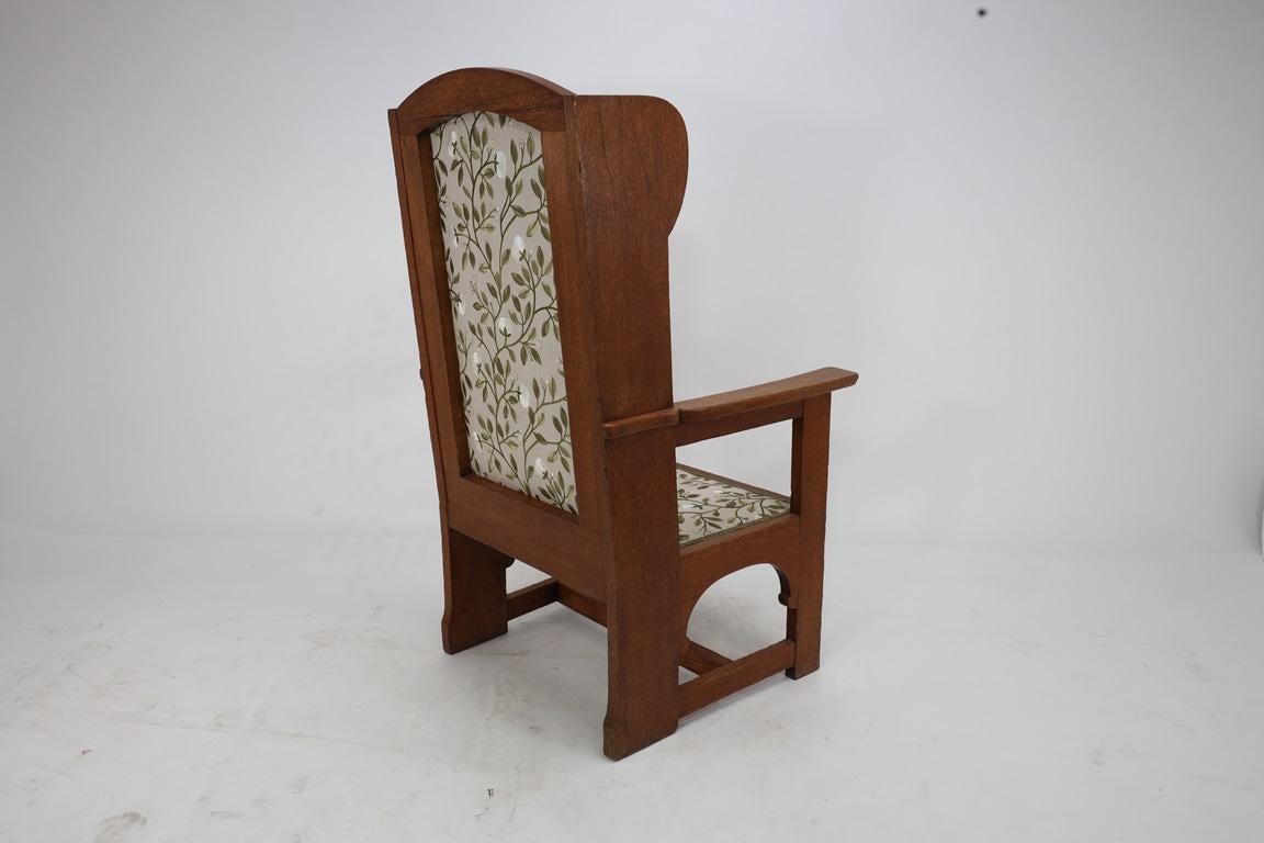 E G Punnet attributed. Probably made by William Birch. An oak wing back armchair For Sale 8