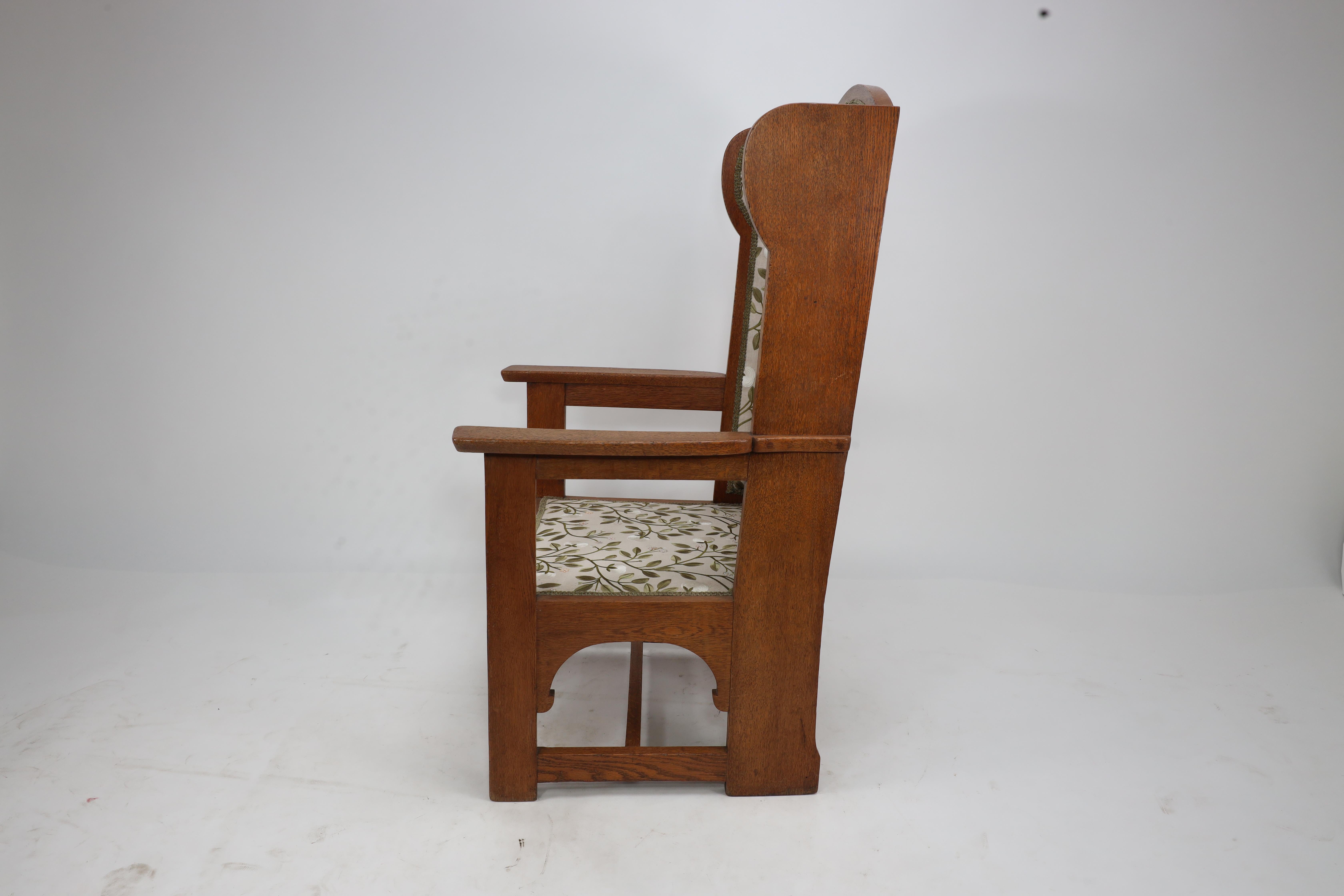 English E G Punnet attributed. Probably made by William Birch. An oak wing back armchair For Sale