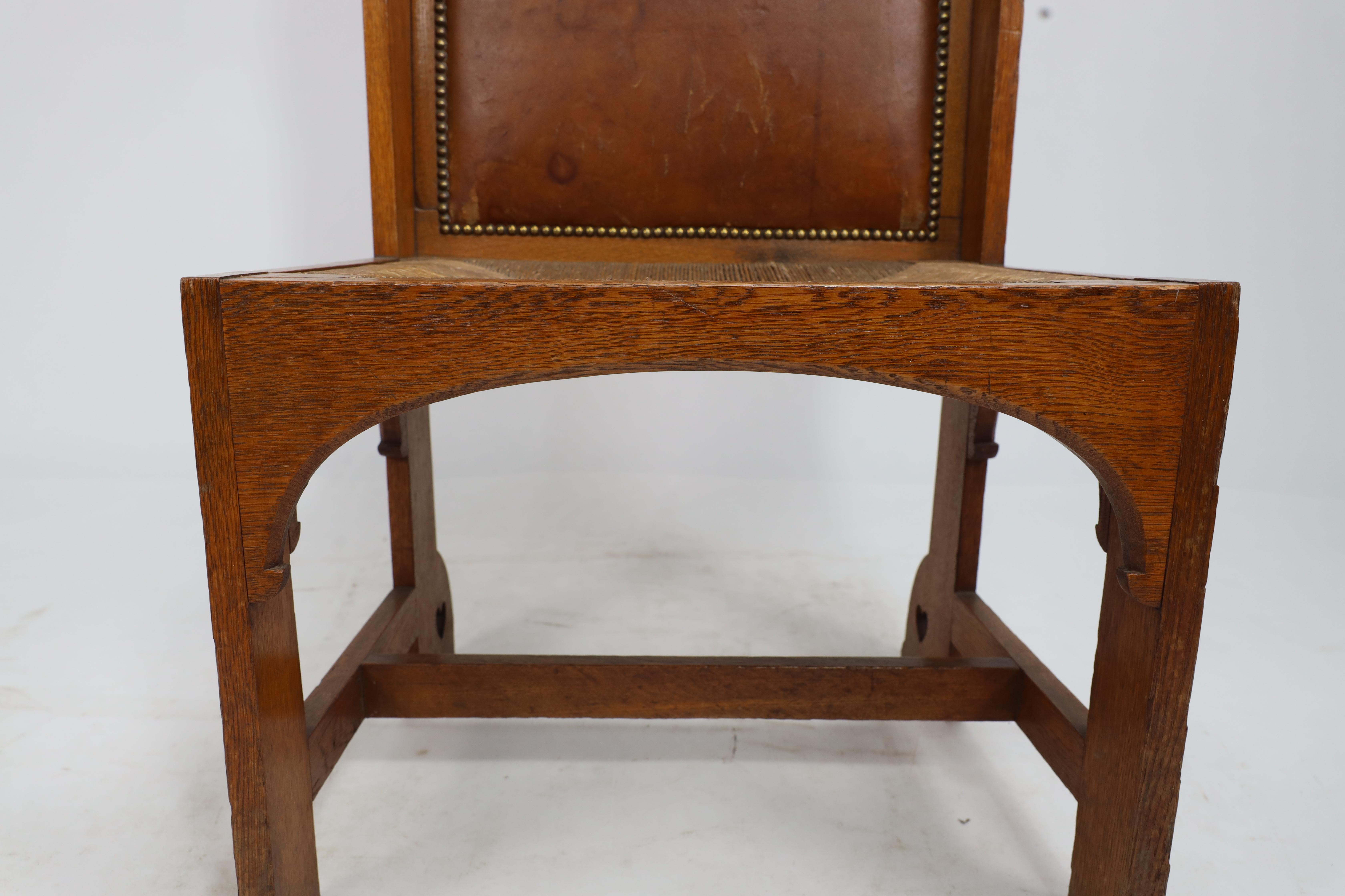 E G Punnet attributed. Probably made by William Birch. An oak wing back chair For Sale 3