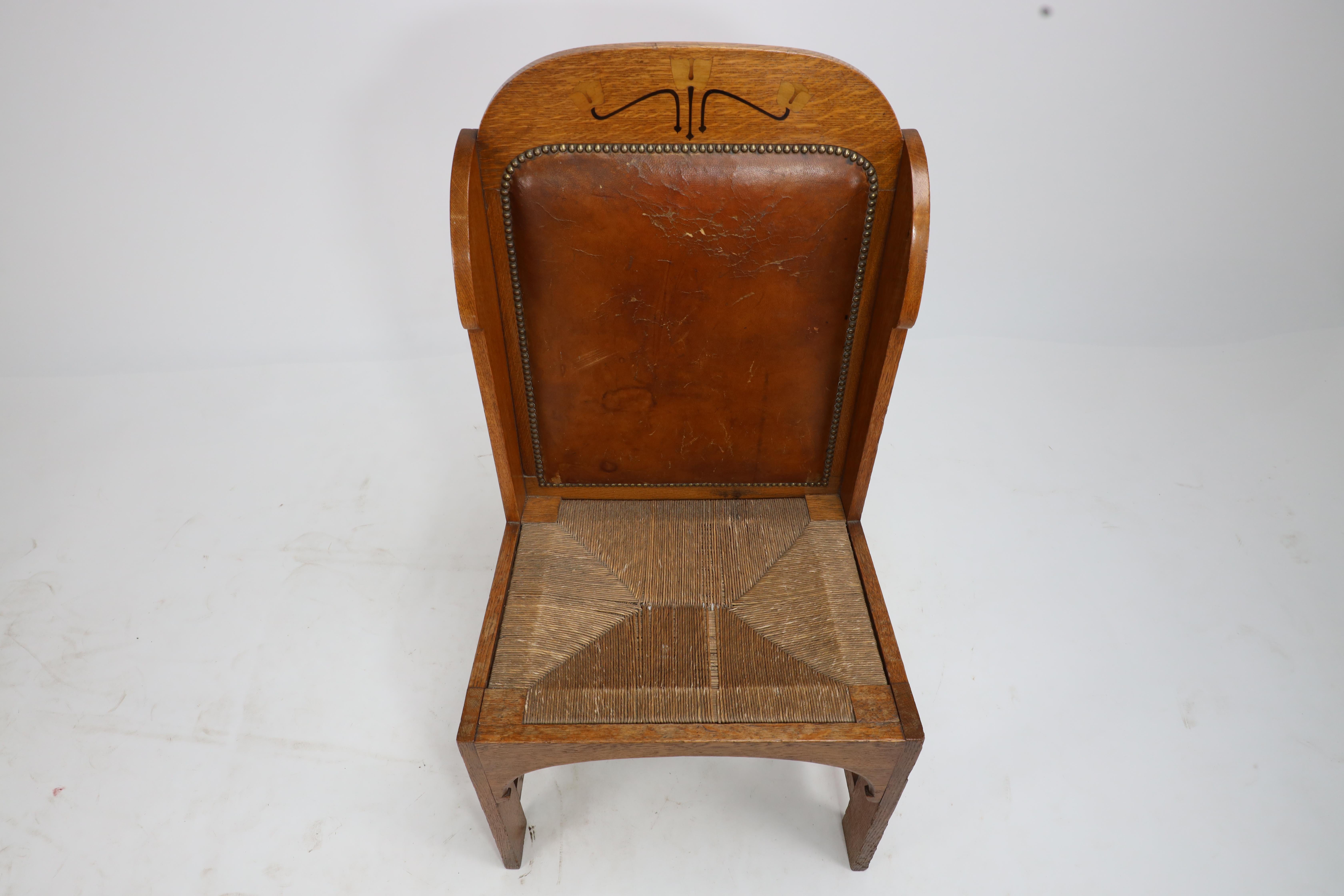 Early 20th Century E G Punnet attributed. Probably made by William Birch. An oak wing back chair For Sale